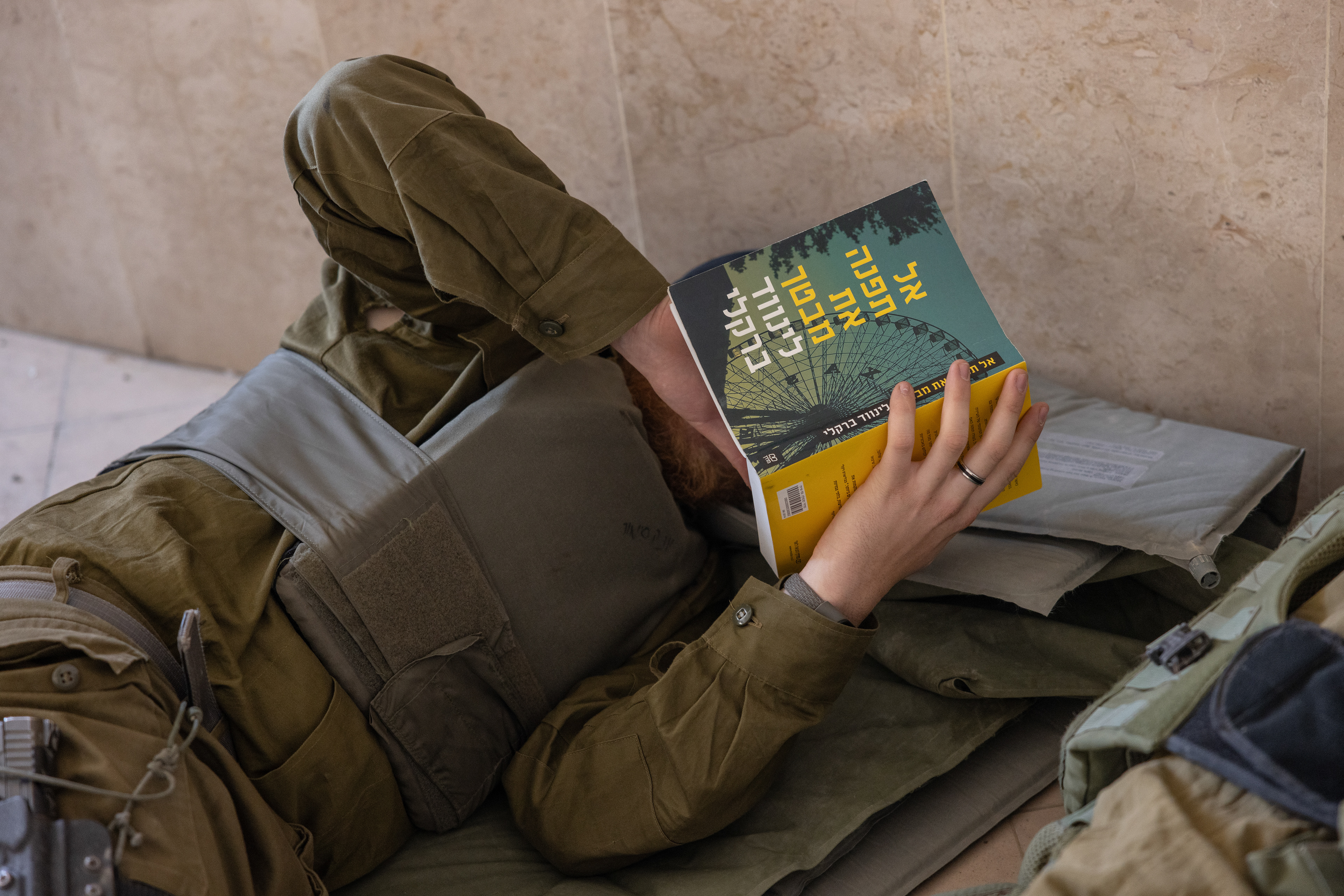 A soldier reads a relevant book in the Turkish hospital