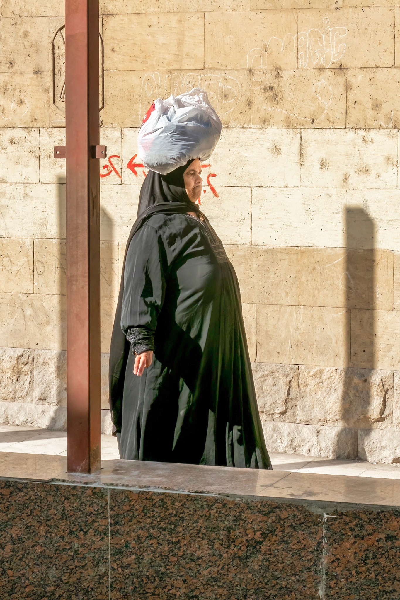 Woman on street near bus
