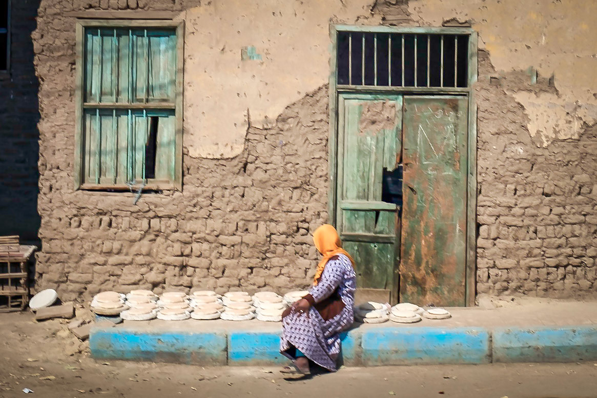 Bread seller, view from bus on way to lunch