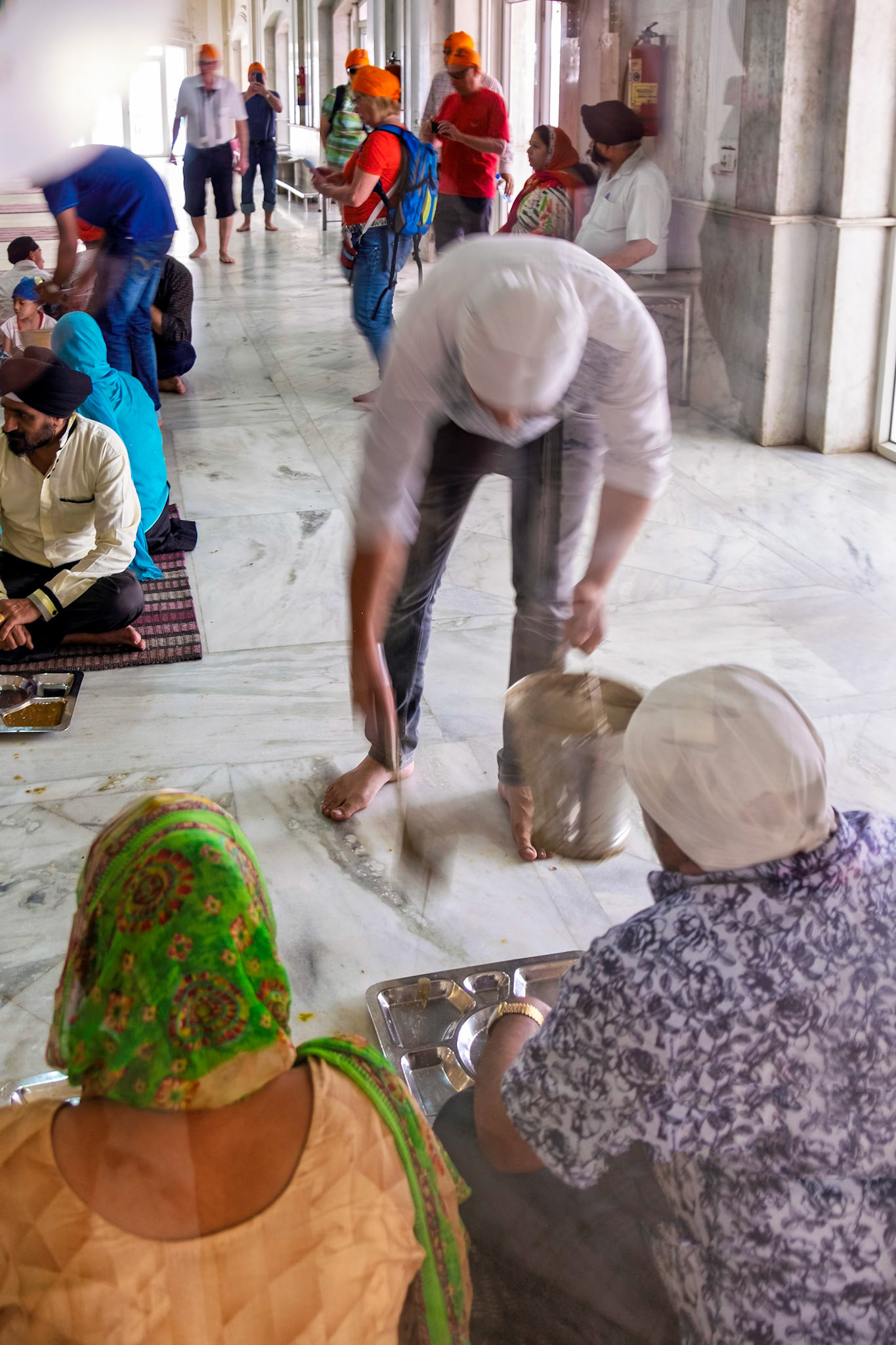 Serving people in dining hall. at Sikh temple
