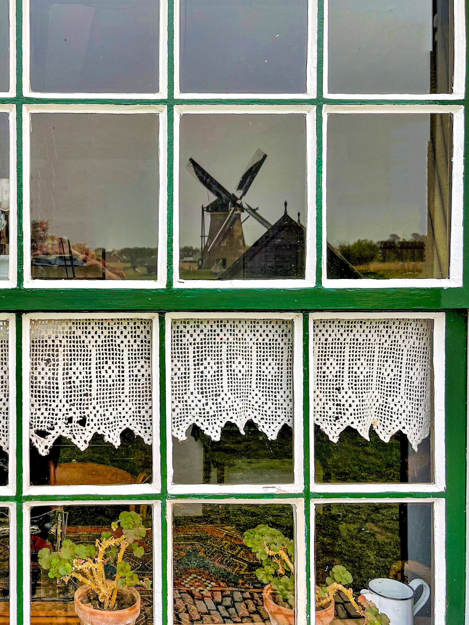 Reflection in windmill window, Kinderdijk Windmill,