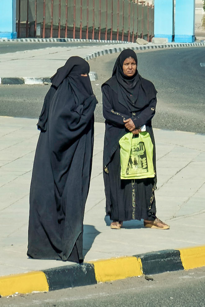 Women crossing a street in Ashwan (shot from bus)