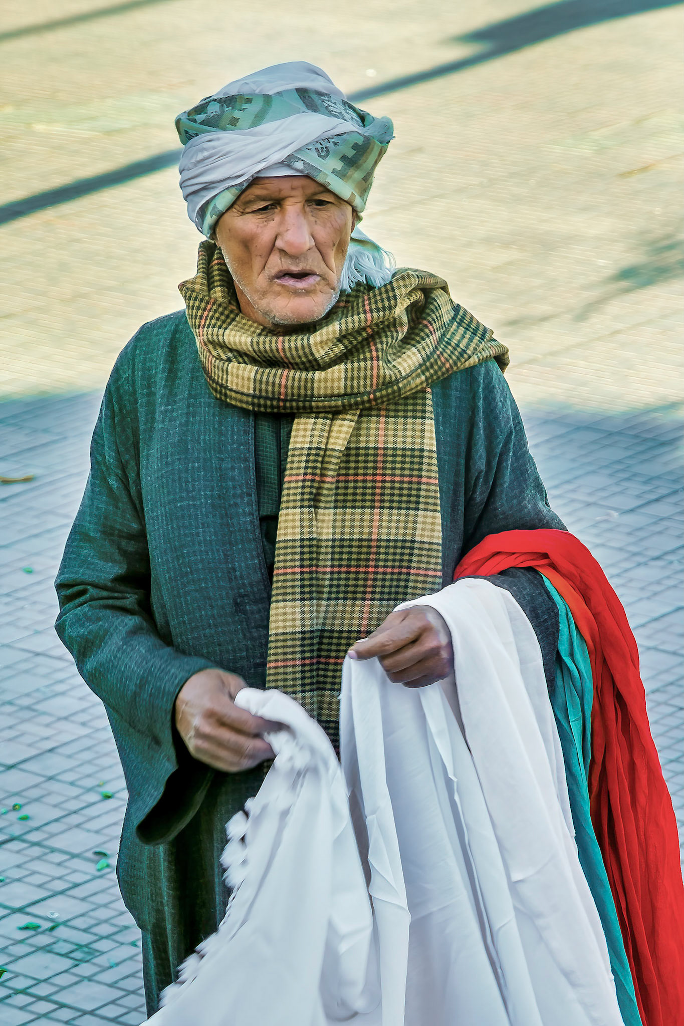 Scarf seller outside bus