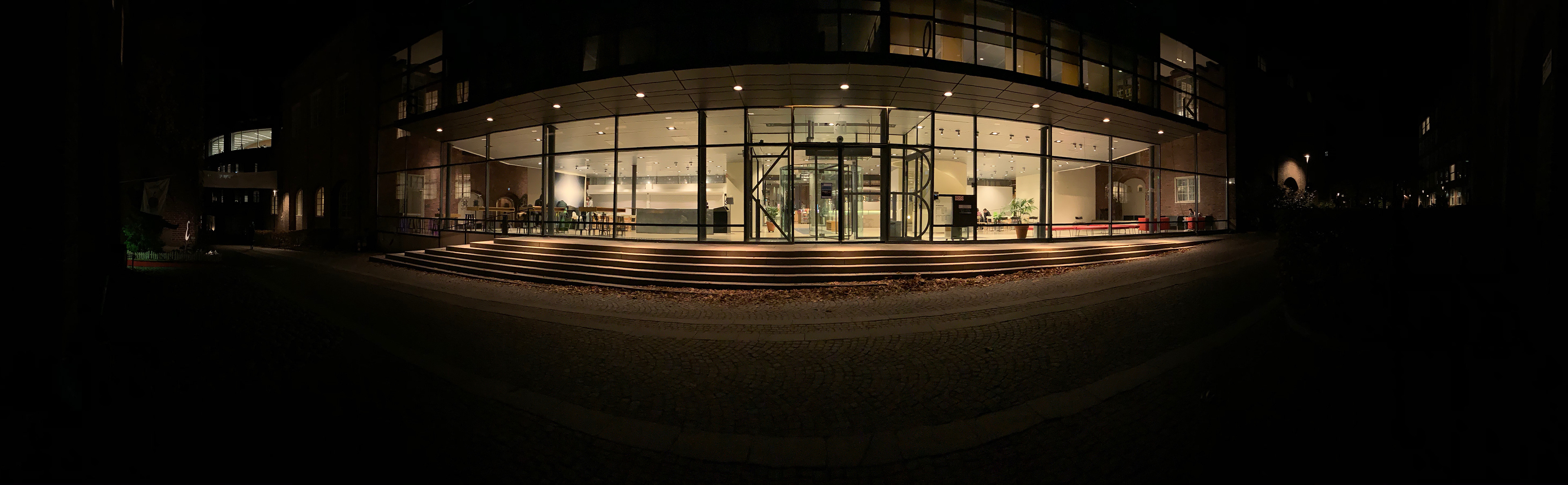 Photo: Panoramic view of library facade with standard operating light level.