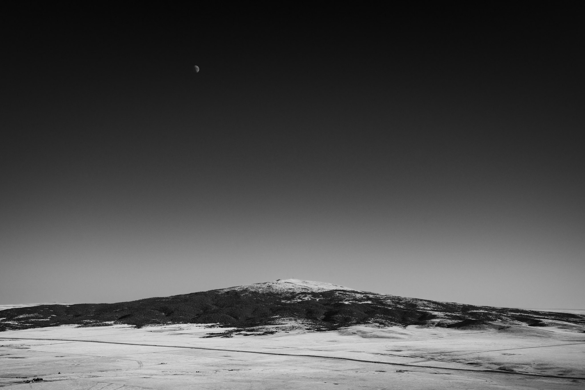 While climbing a cinder cone at sunset, my favorite capture was taken facing a nearby cinder cone volcano with the rising moon.