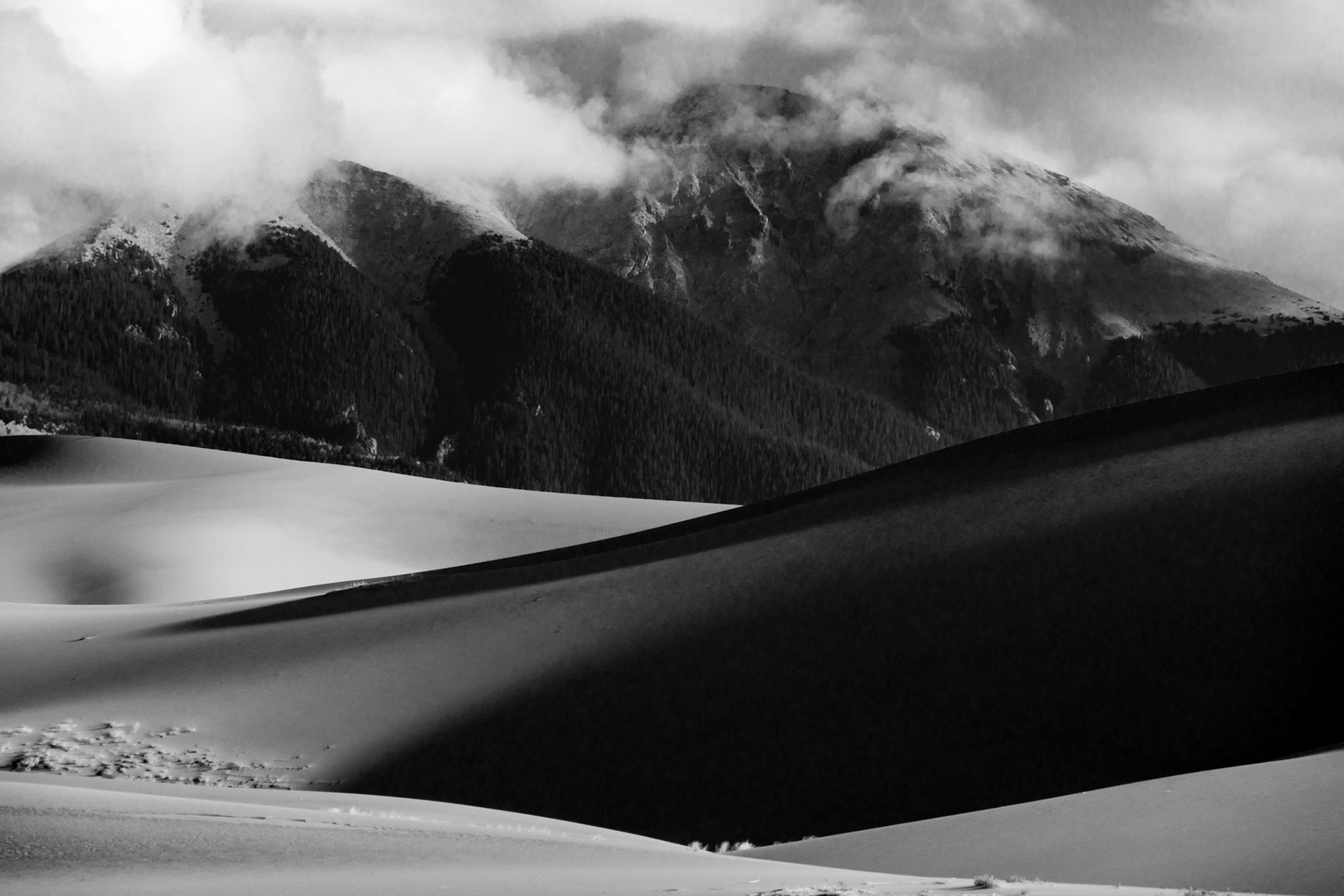 While hiking in Great Sand Dunes National Park during a storm, this scene showed itself as the storm retreated.