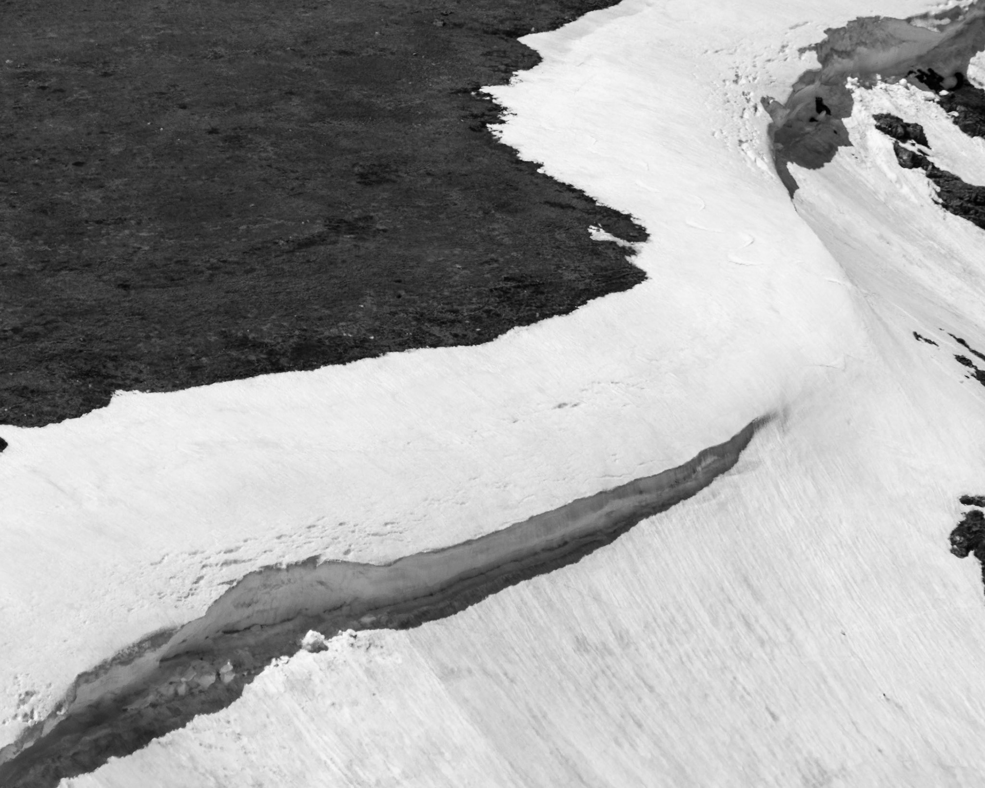 A June cornice on the Continental Divide symbolically demarcates the edge of winter and the warm season in the Colorado high country.