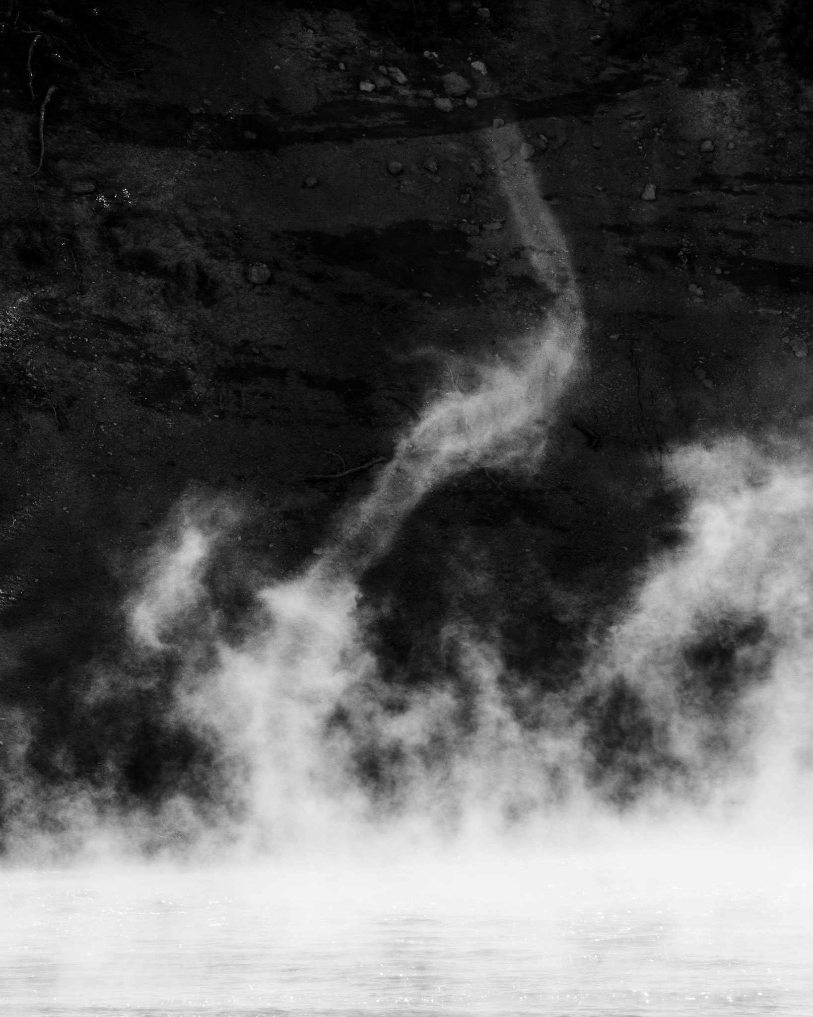 While observing a mud volcano in Yellowstone National Park looking for a composition, I became fixated on the patterns and maelstroms in the steam. After exploring a few compositions including the mud volcano with the steam, I decided to instead focus on the steam itself. A steam devil spun up and I knew I had my image.