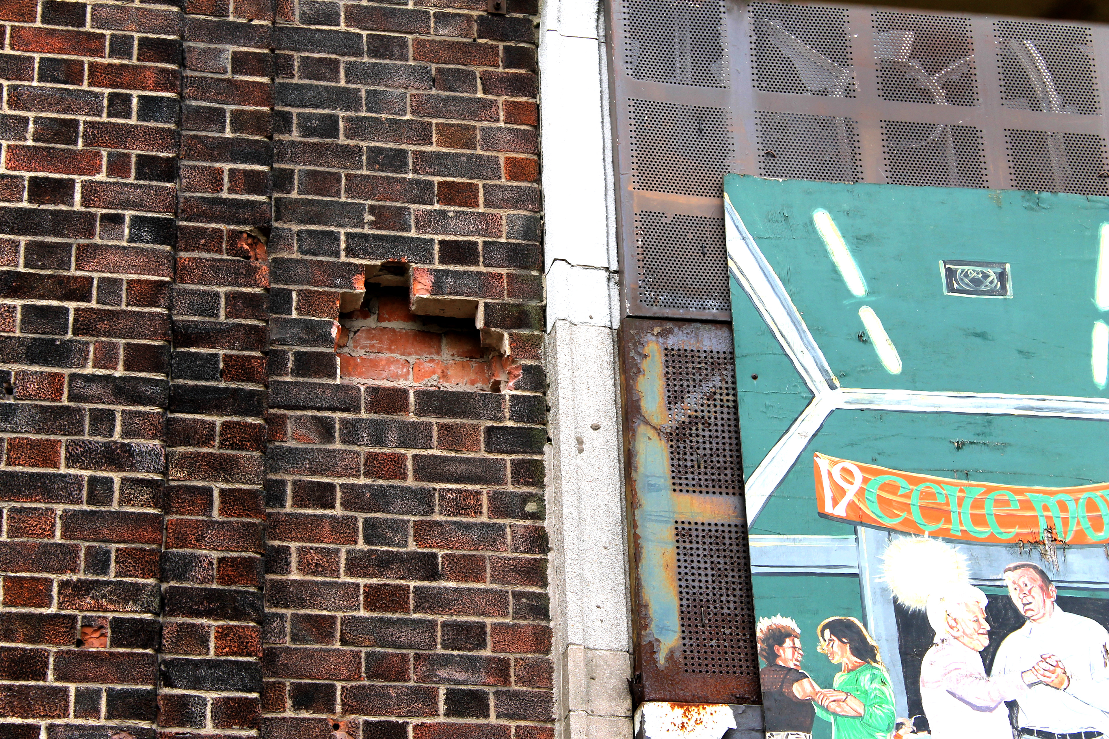 Bullet holes in the wall of St Comgall's primary school, Divis Street, Belfast
