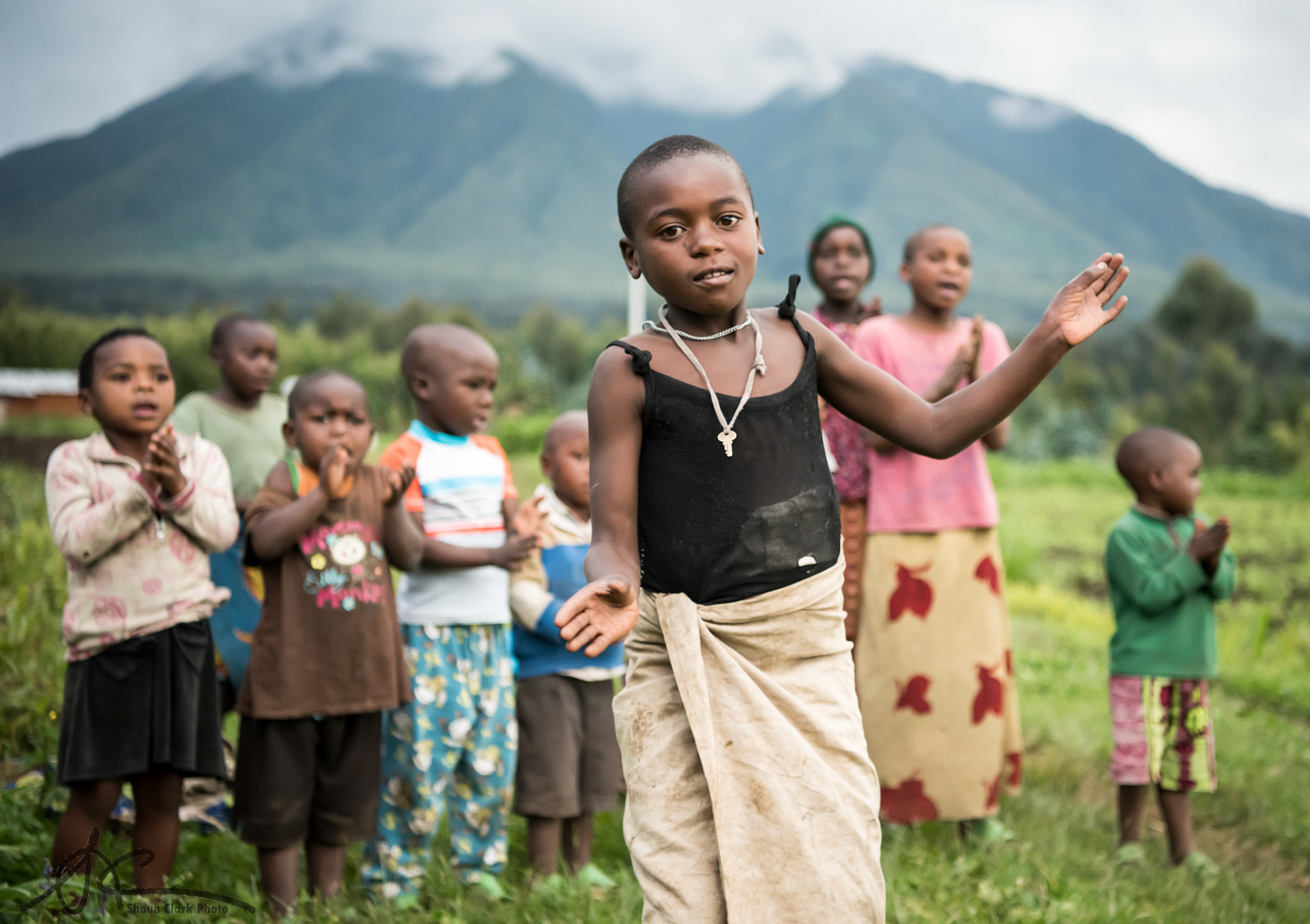 RUHENGERI, RWANDA - APRIL 20:  Children of the Ngyang Community perform a song and dance (Photo: Shaun Clark).