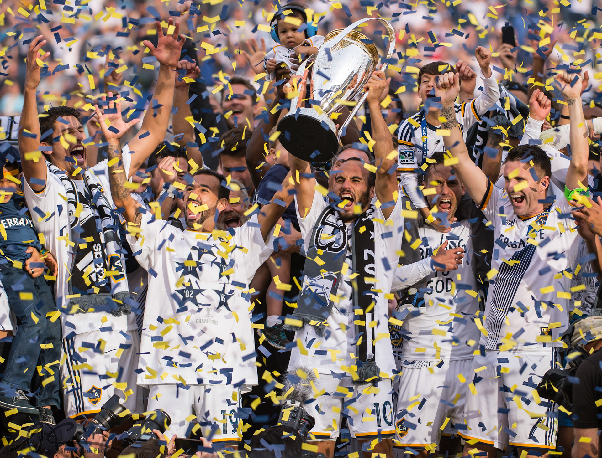Carson, California – December 7, 2014. LA Galaxy's Landon Donovan (#10) lifts the Phil Anshcutz MLS Cup trophy after the LA Galaxy defeated the NE Revolution 2-1 after overtime at the StubHub Center in Carson, California (Photo: Shaun Clark).