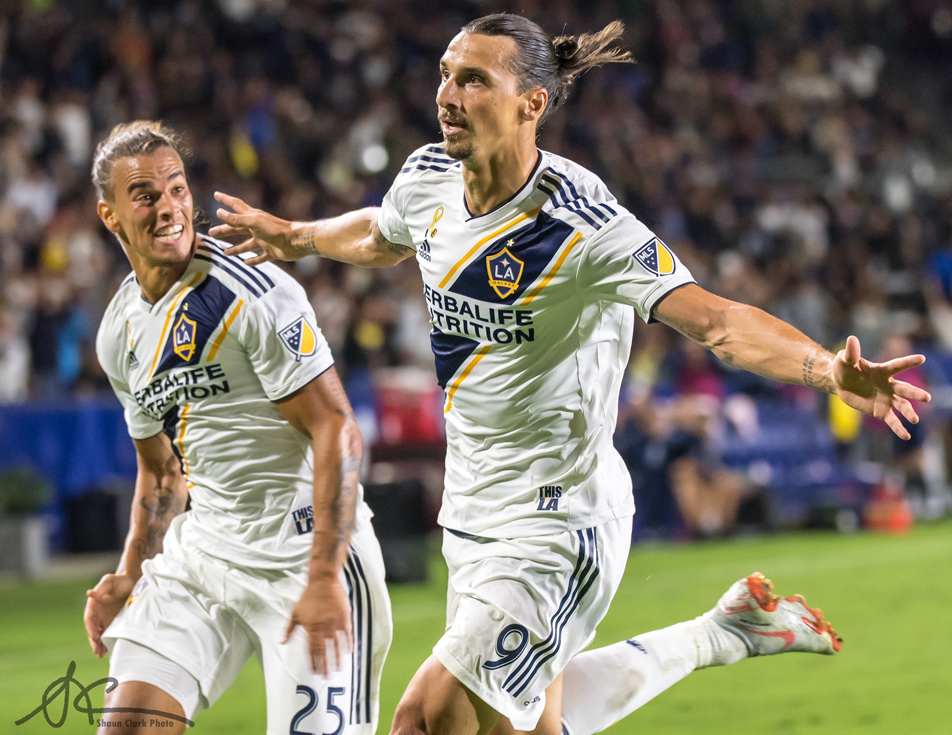 CARSON, CA - SEPTEMBER 29:  Zlatan Ibrahimovic #9 of Los Angeles Galaxy celebrates his 2nd goal with Rolf Feltscher #25 of Los Angeles Galaxy during the Los Angeles Galaxy's MLS match against Vancouver Whitecaps at the StubHub Center on September 29, 2018 in Carson, California.  The Los Angeles Galaxy won the match 3-0 (Photo by Shaun Clark/Getty Images) *** Local Caption *** Rolf Feltscher ;Zlatan Ibrahimovic