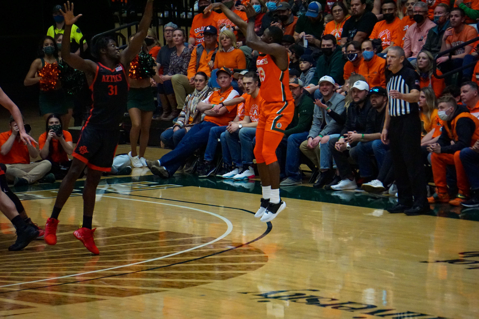Chandler Jacobs shooting a three point shot