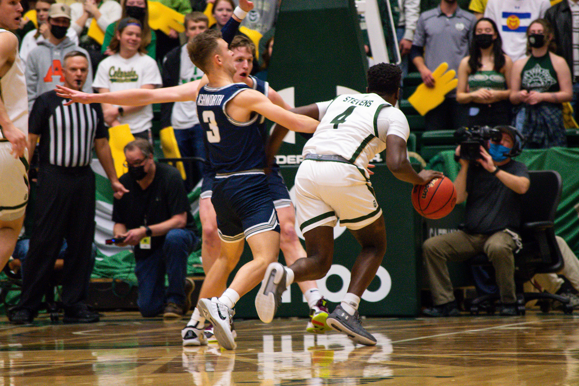 Isaiah Stevens dribbling in to shoot a layup