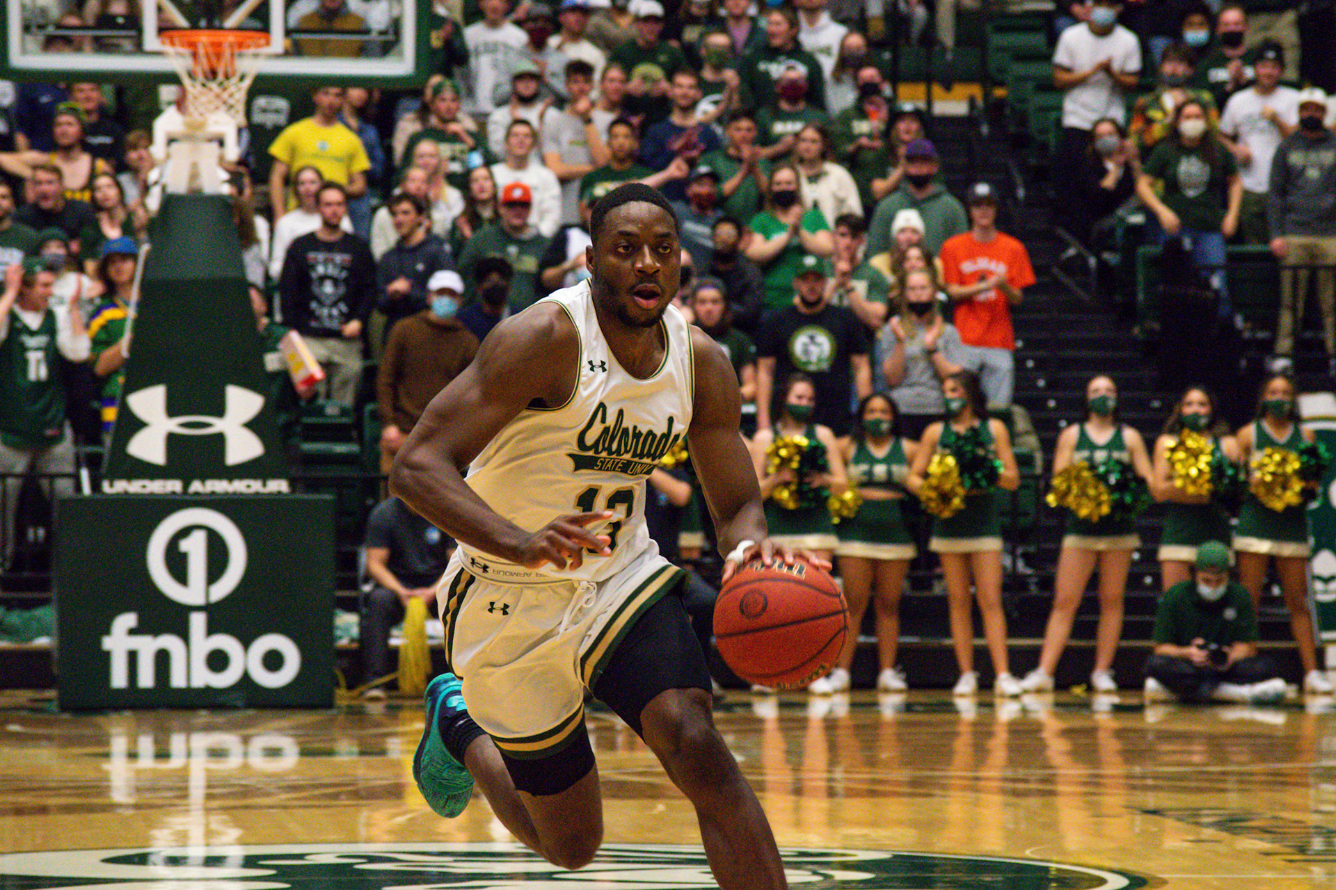 Chandler Jacobs dribbling the ball down the court