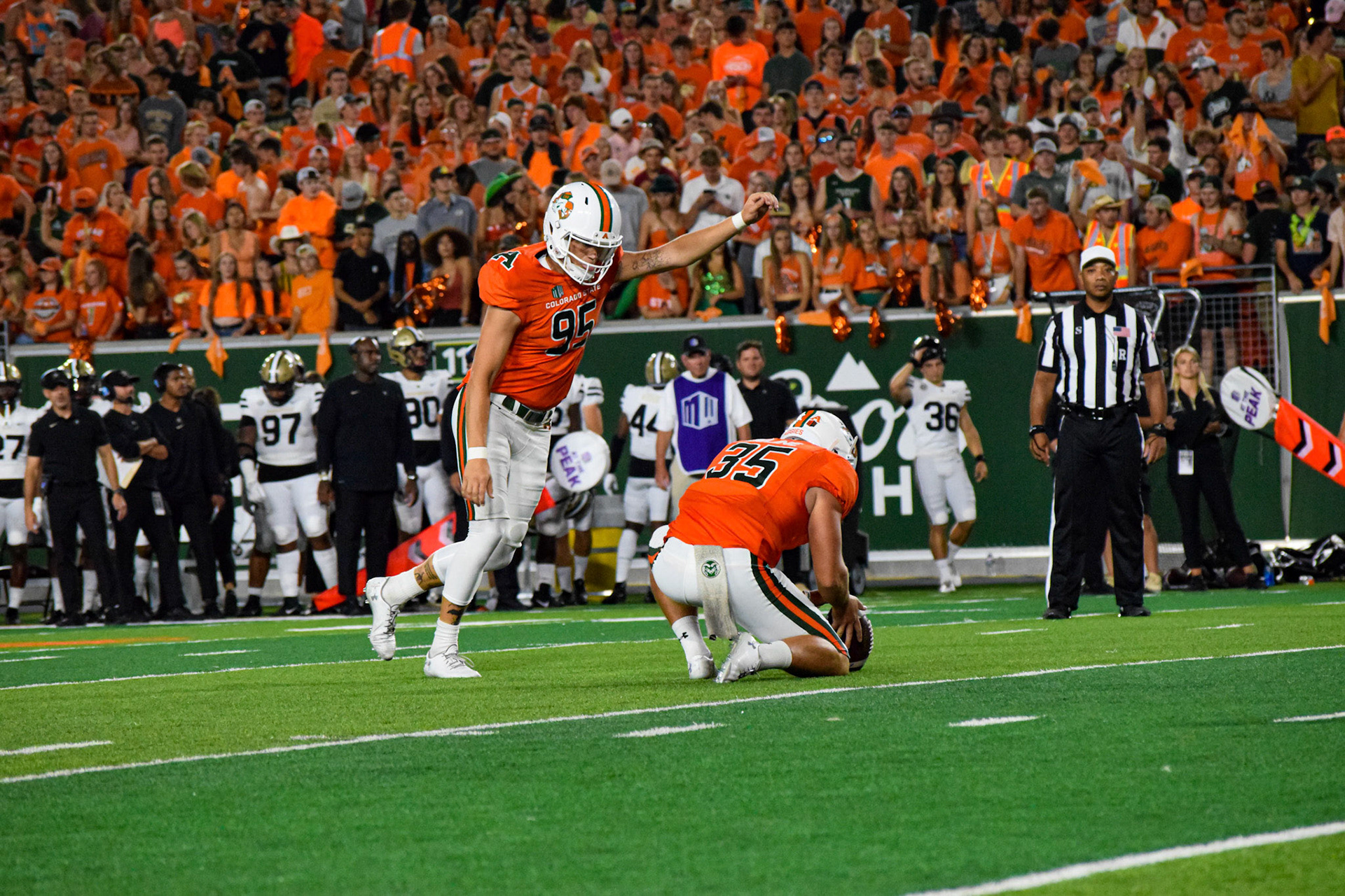 Cayden Camper kicking field goal