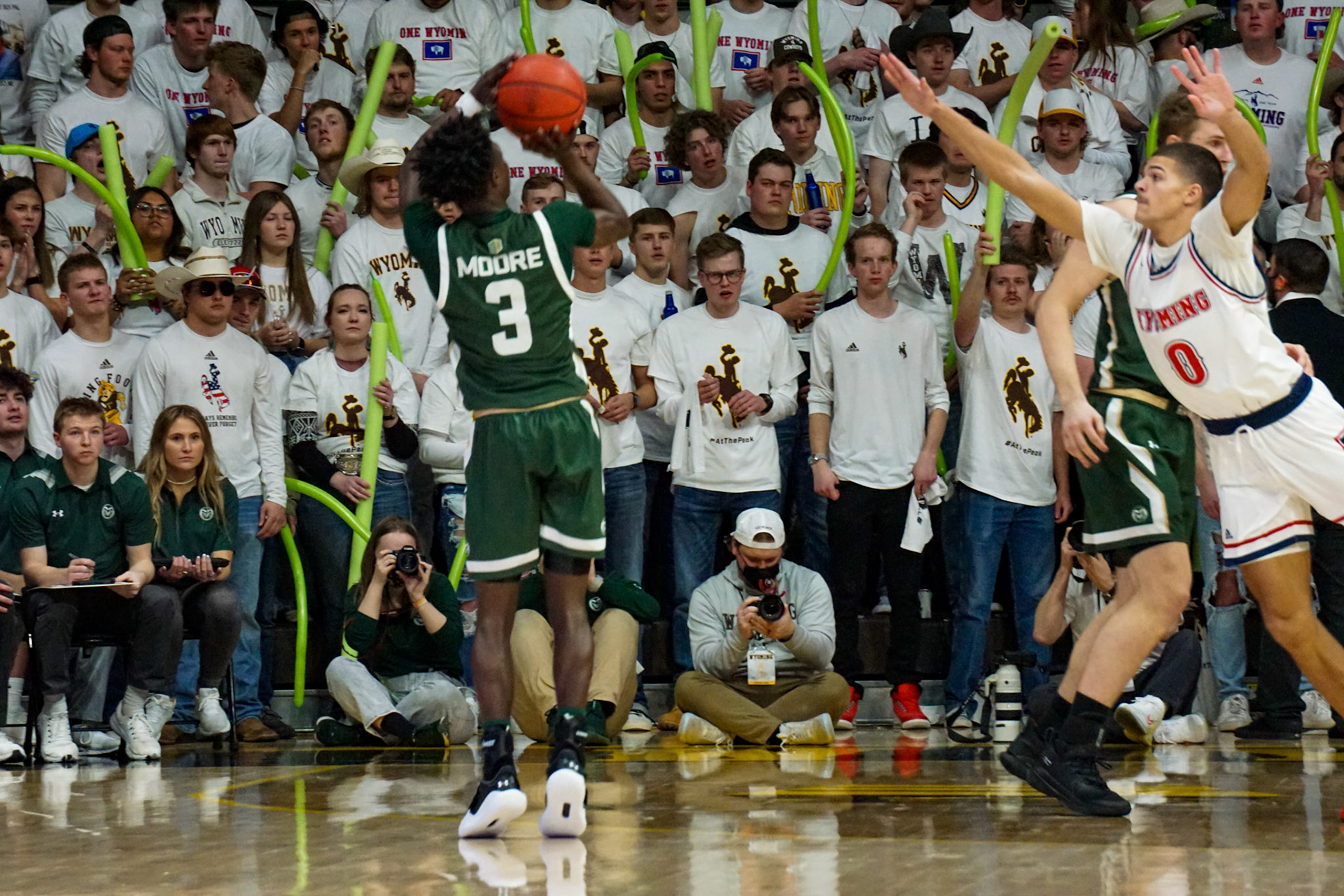 Kendle Moore shooting a three point shot