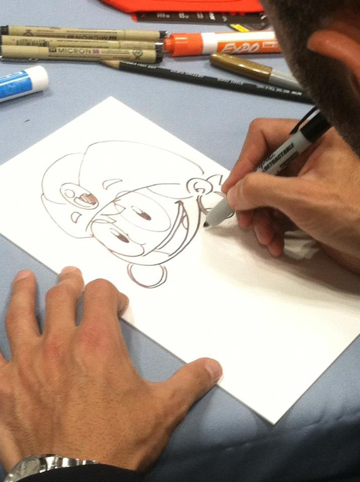 Matteo Stanzani draws Genie the Genius for a young fan.
