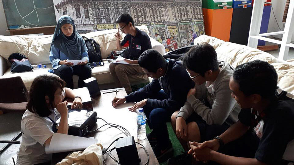 Students brainstorming before the filming began.
