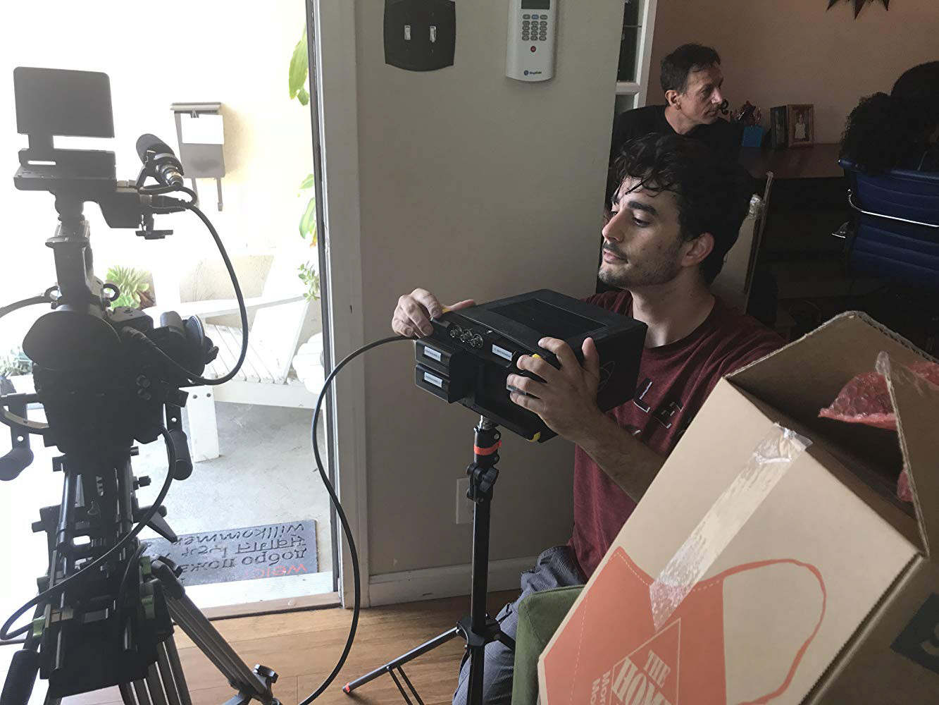 Cinematographer Jon Latona setting up the scene