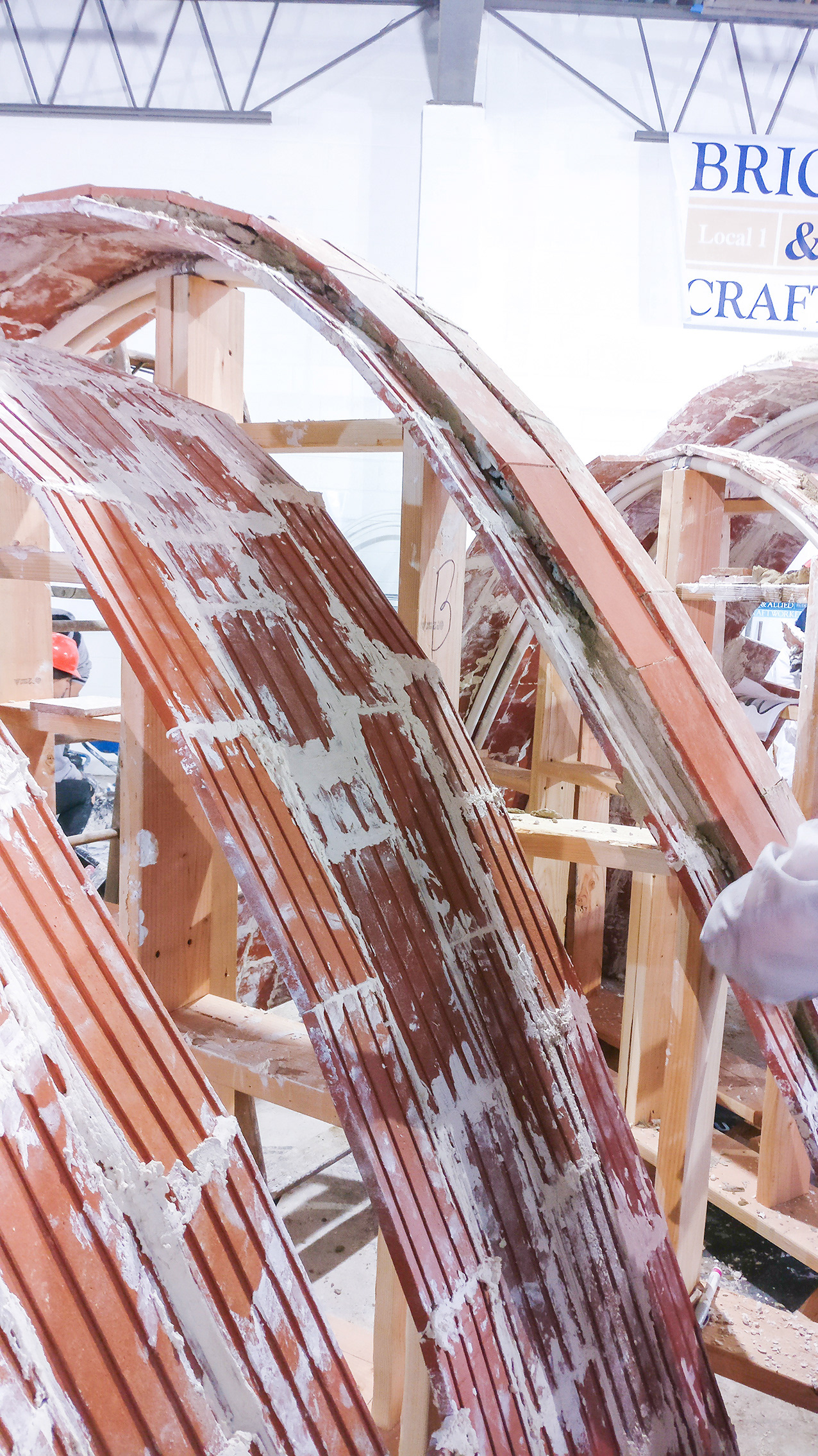 Splitting the arch into two is a crucial tectonic aspect of the design. It has a quality that brick usually doesn’t do.
