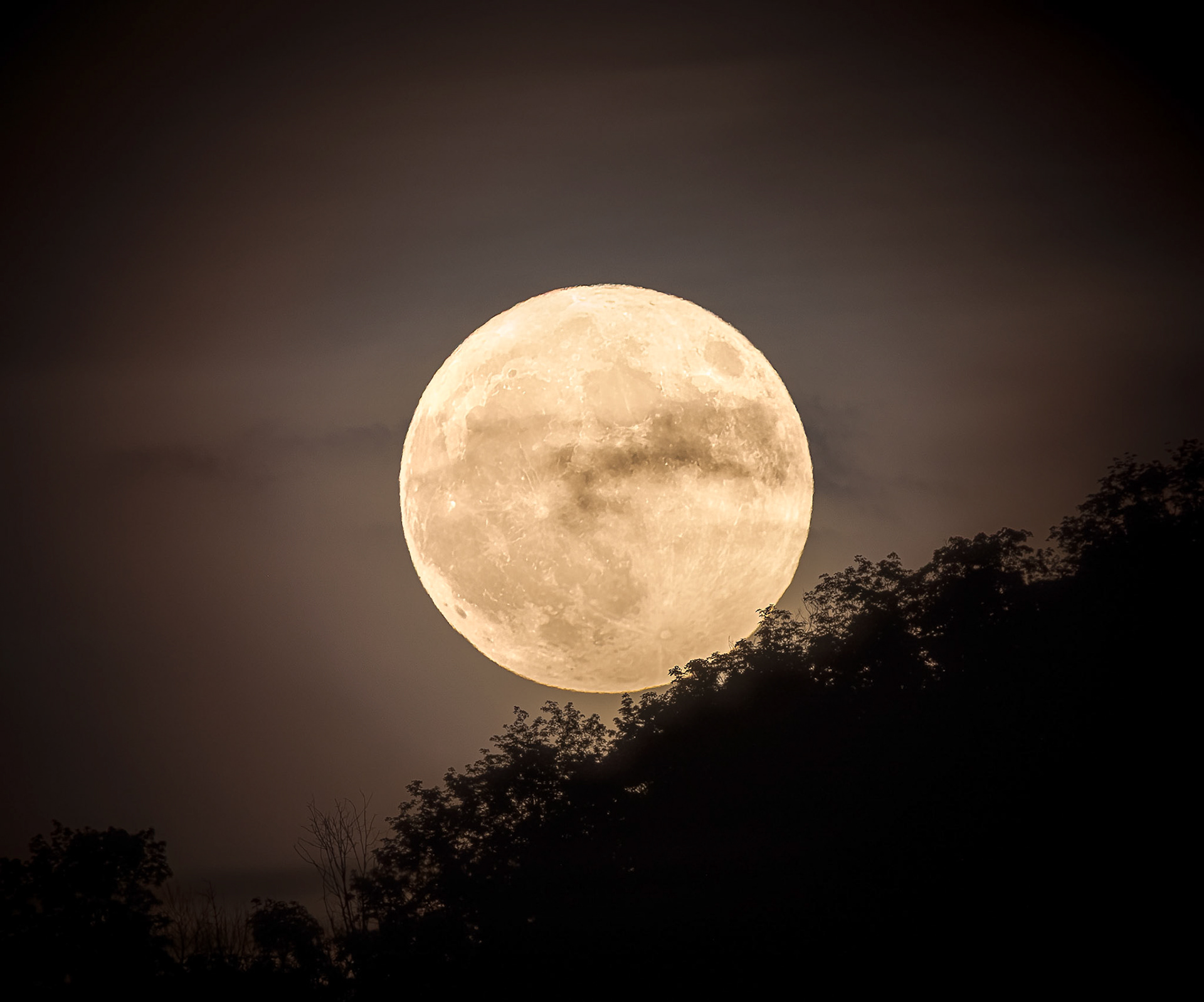 Strawberry Moon rising above Hunter Mountain in New York
