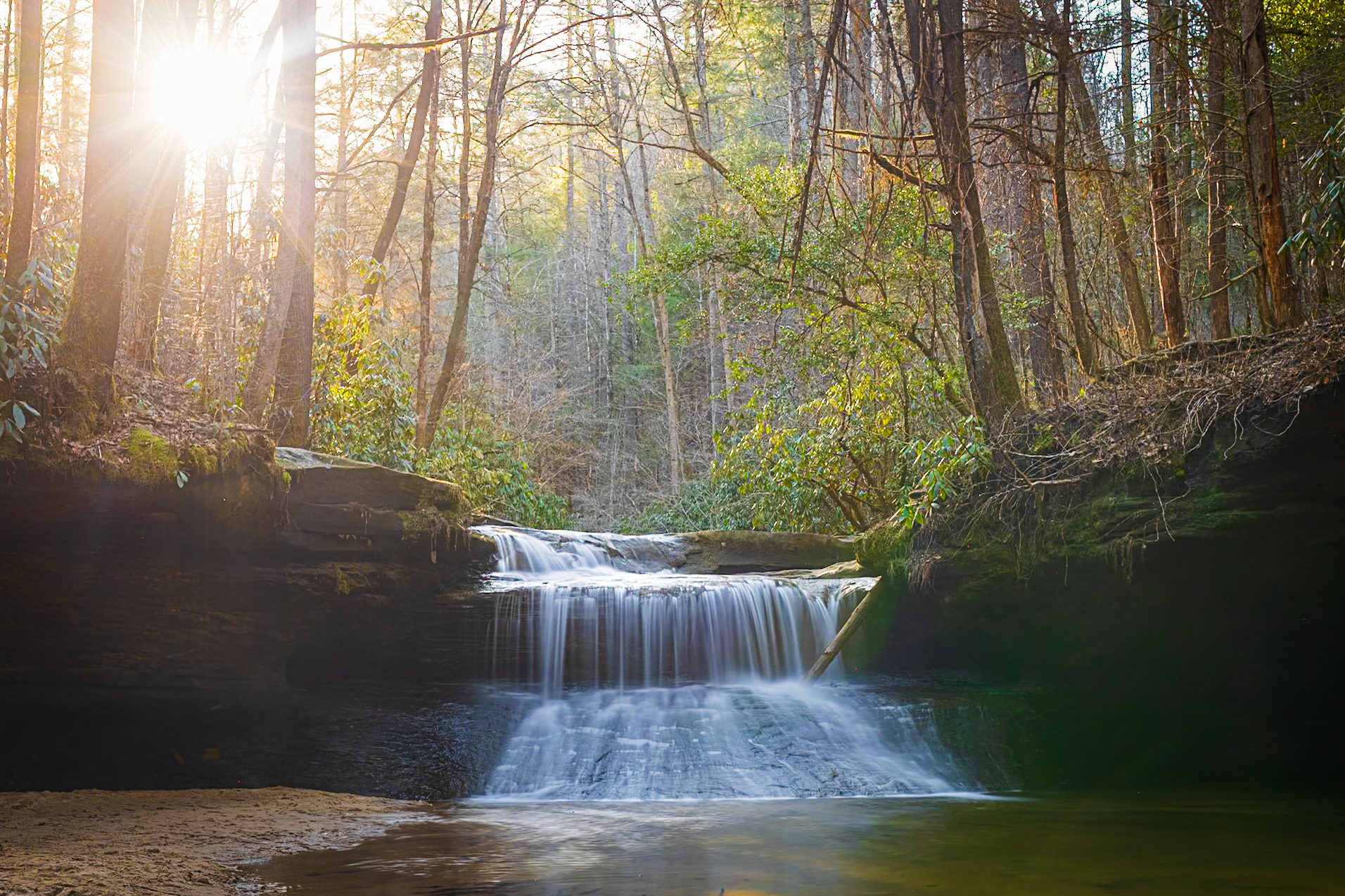 Warm late day sun backlighting Creation Falls in Kentucky