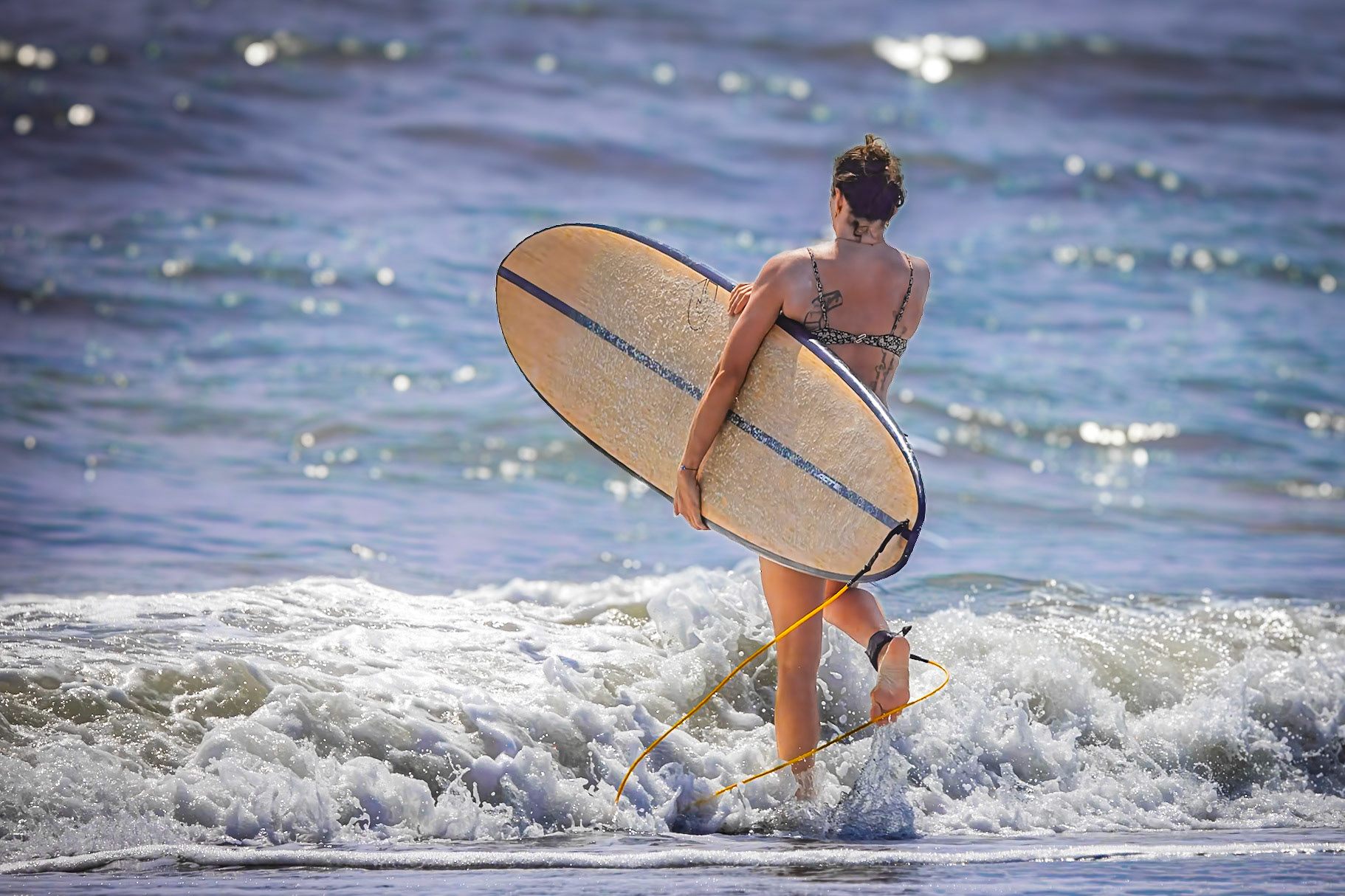Surfer hitting the water at St Augustine beach