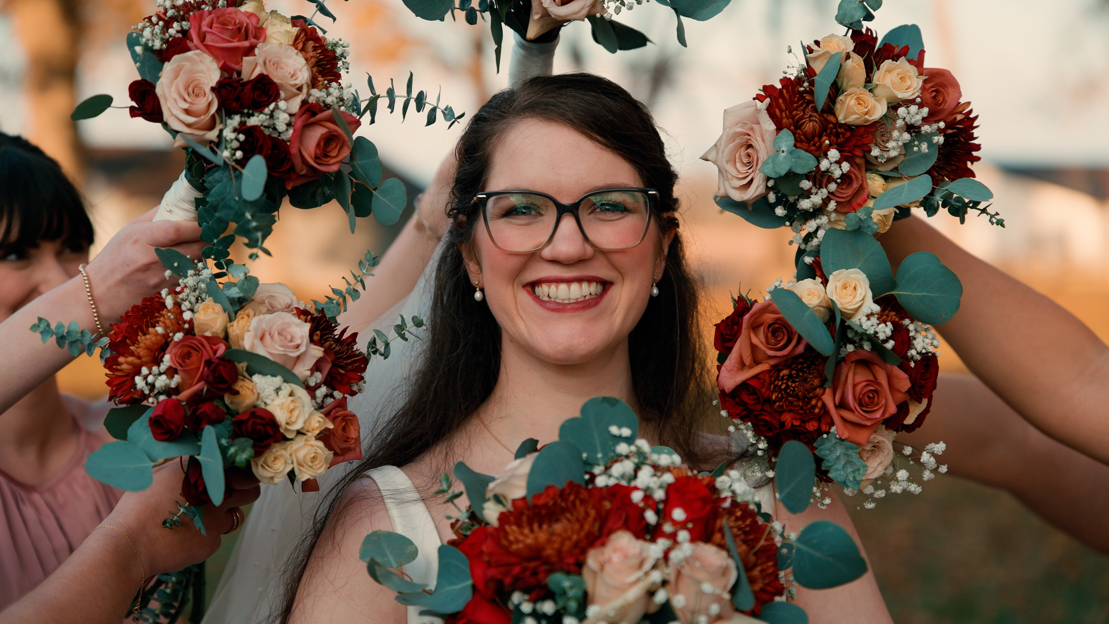 Bride smiling with bouquet wreath