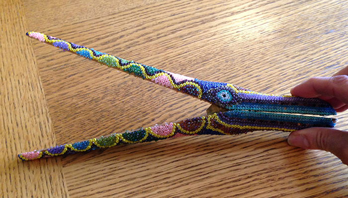 WOODEN TONGS: glued seed beads