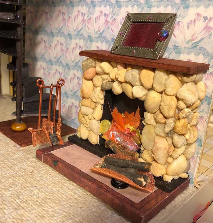 FIREPLACE (stones, wood, paper fire), LOG HOLDER (copper screening, wooden bead), HANGING TOOLS (copper screening, copper wire, yarn) & SPIRAL STAIRCASE (wood)