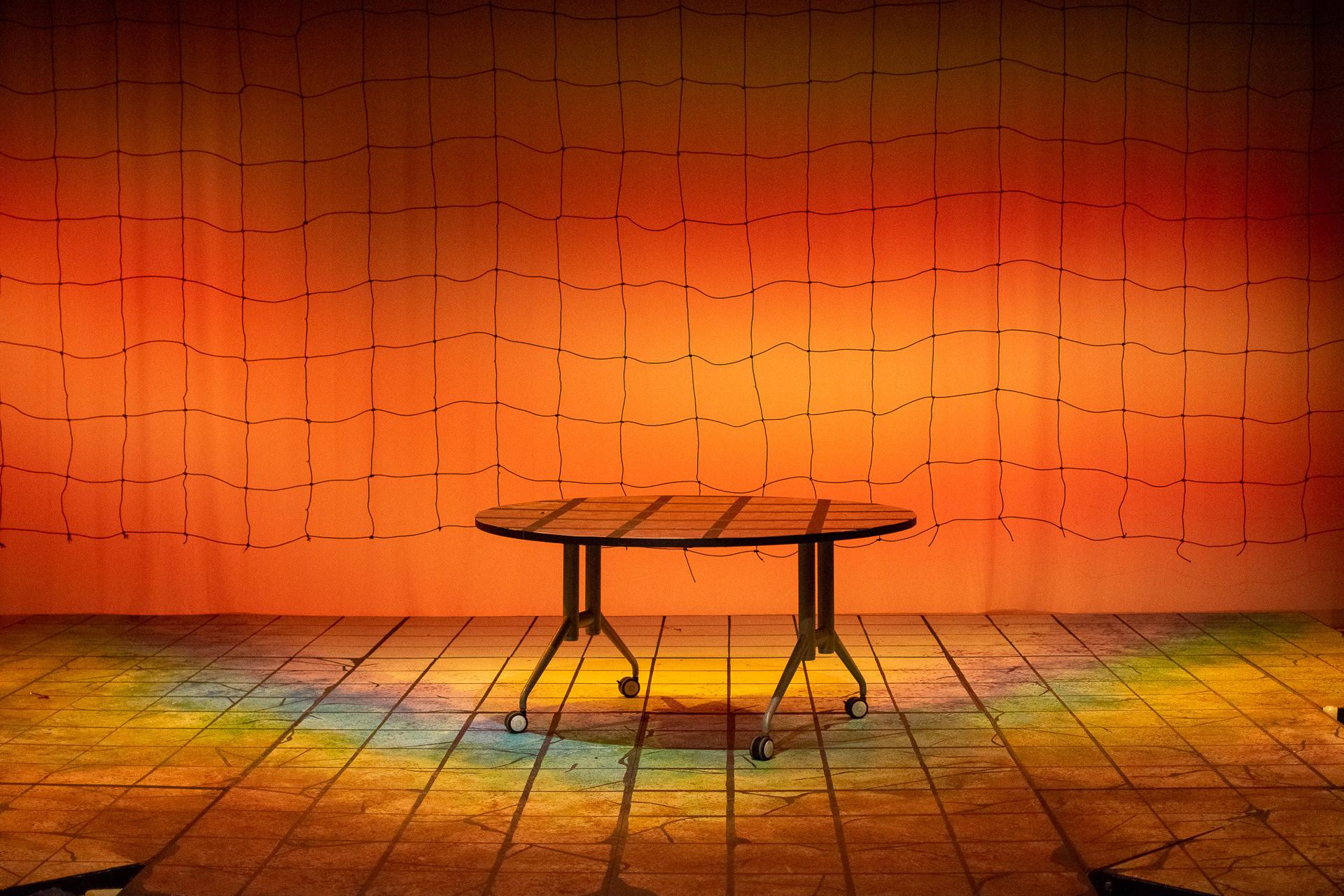 A grid was hung to continue the design of the floor in front of the projection scene.