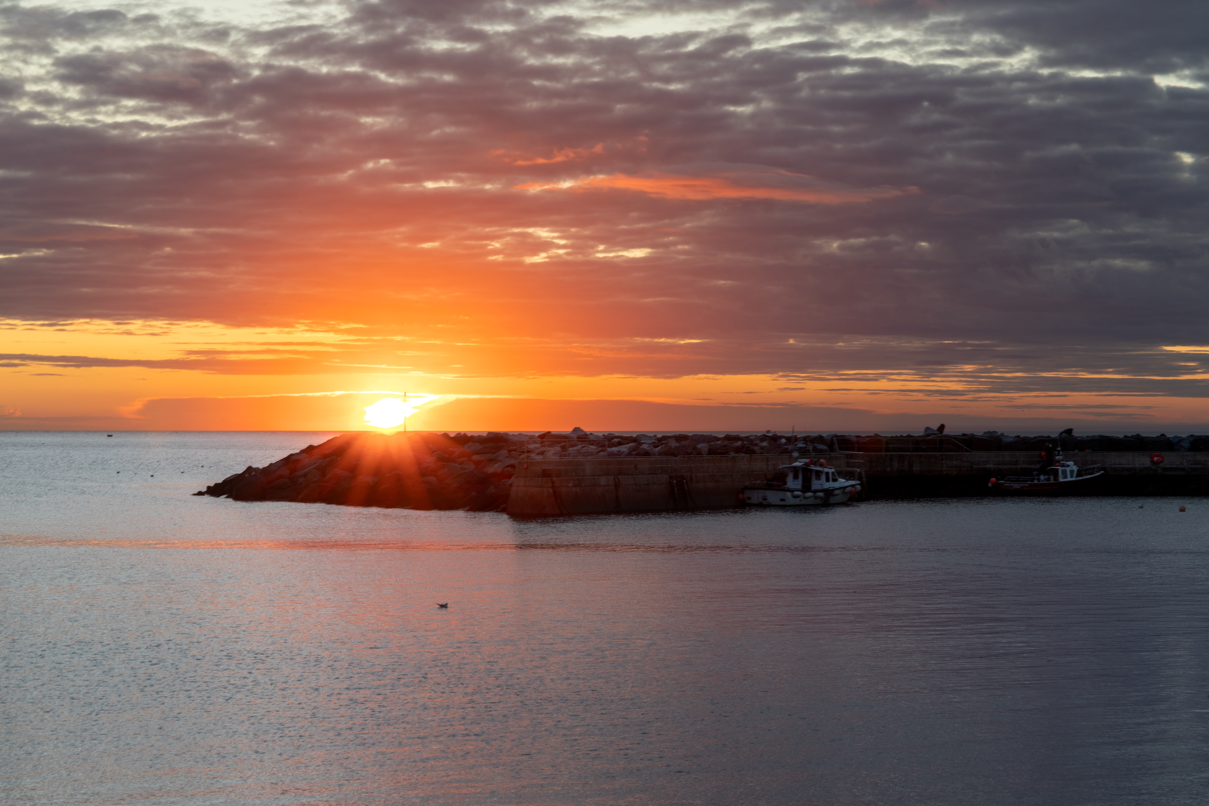 Sunrise over the sea wall