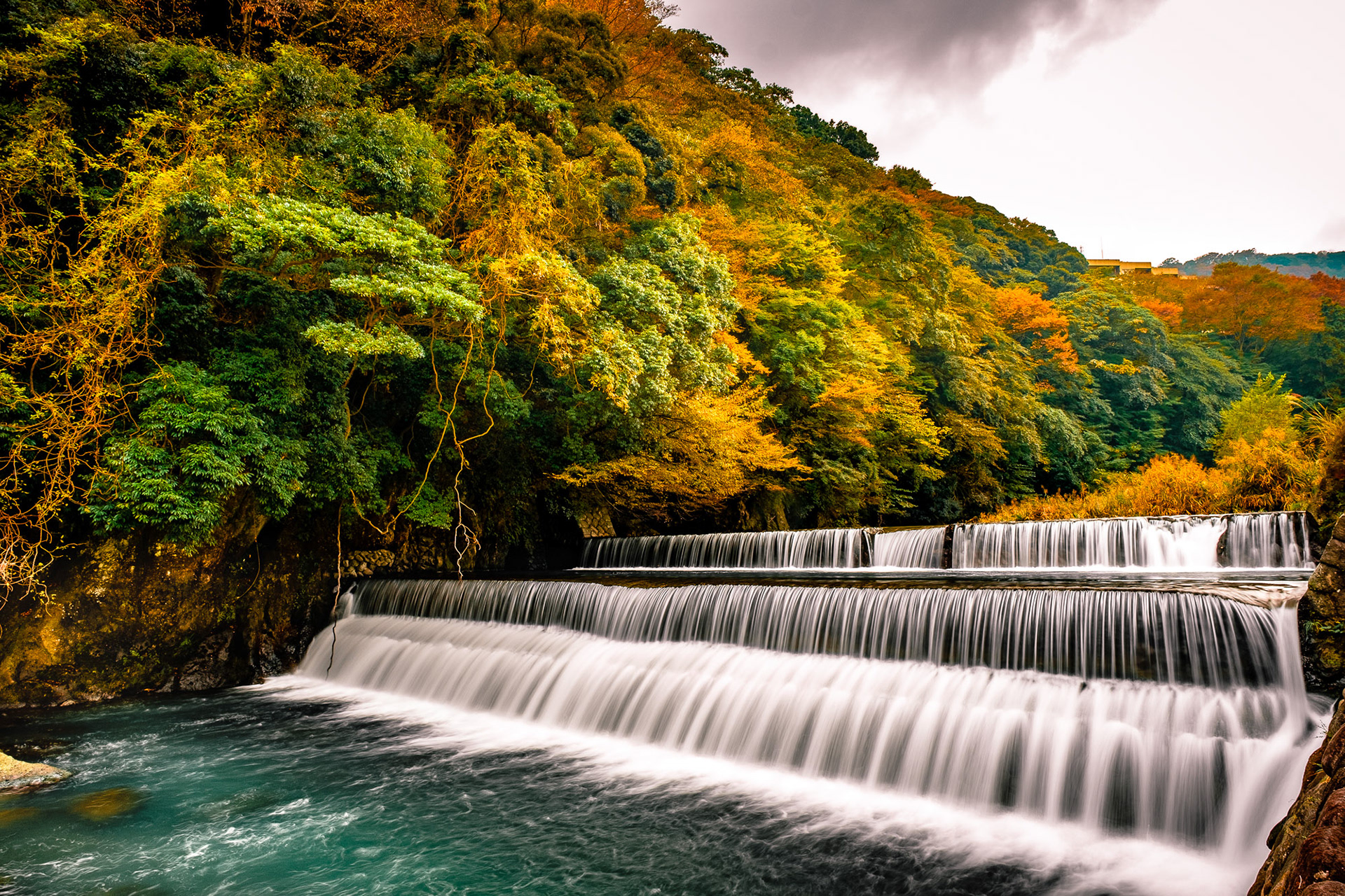 Hayakawa River with autumn foliage and bridge in Hakone