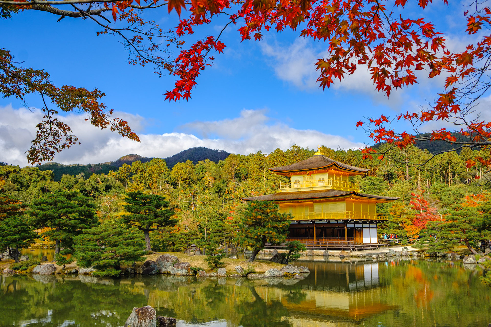 Temple of the Golden Pavilion (Kinkaku-ji (金閣寺) is surreal in its beauty. The top two stories of the pavilion are covered with pure gold leaf.