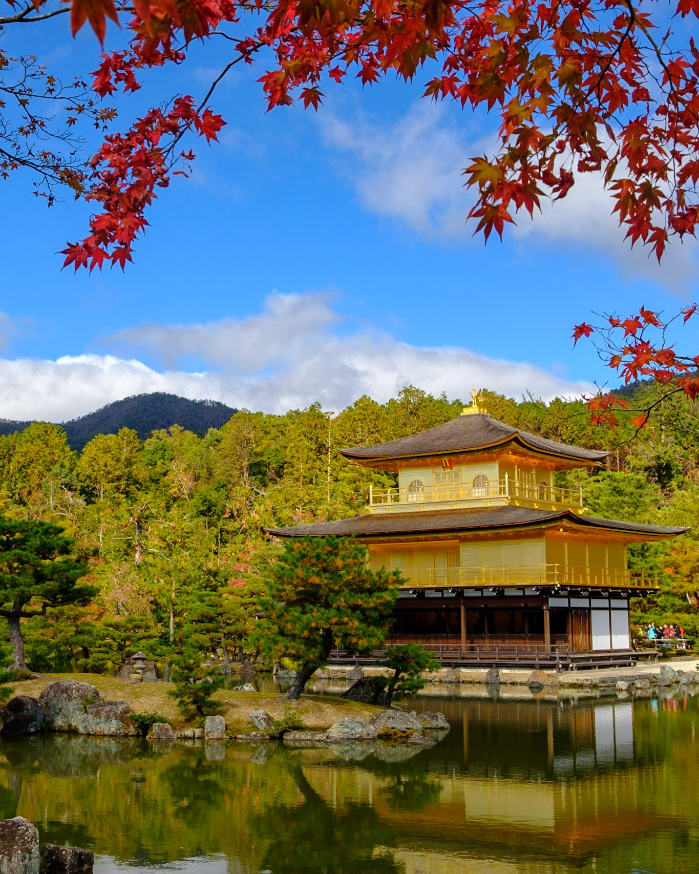 Temple of the Golden Pavilion (Kinkaku-ji (金閣寺) is surreal in its beauty. The top two stories of the pavilion are covered with pure gold leaf.