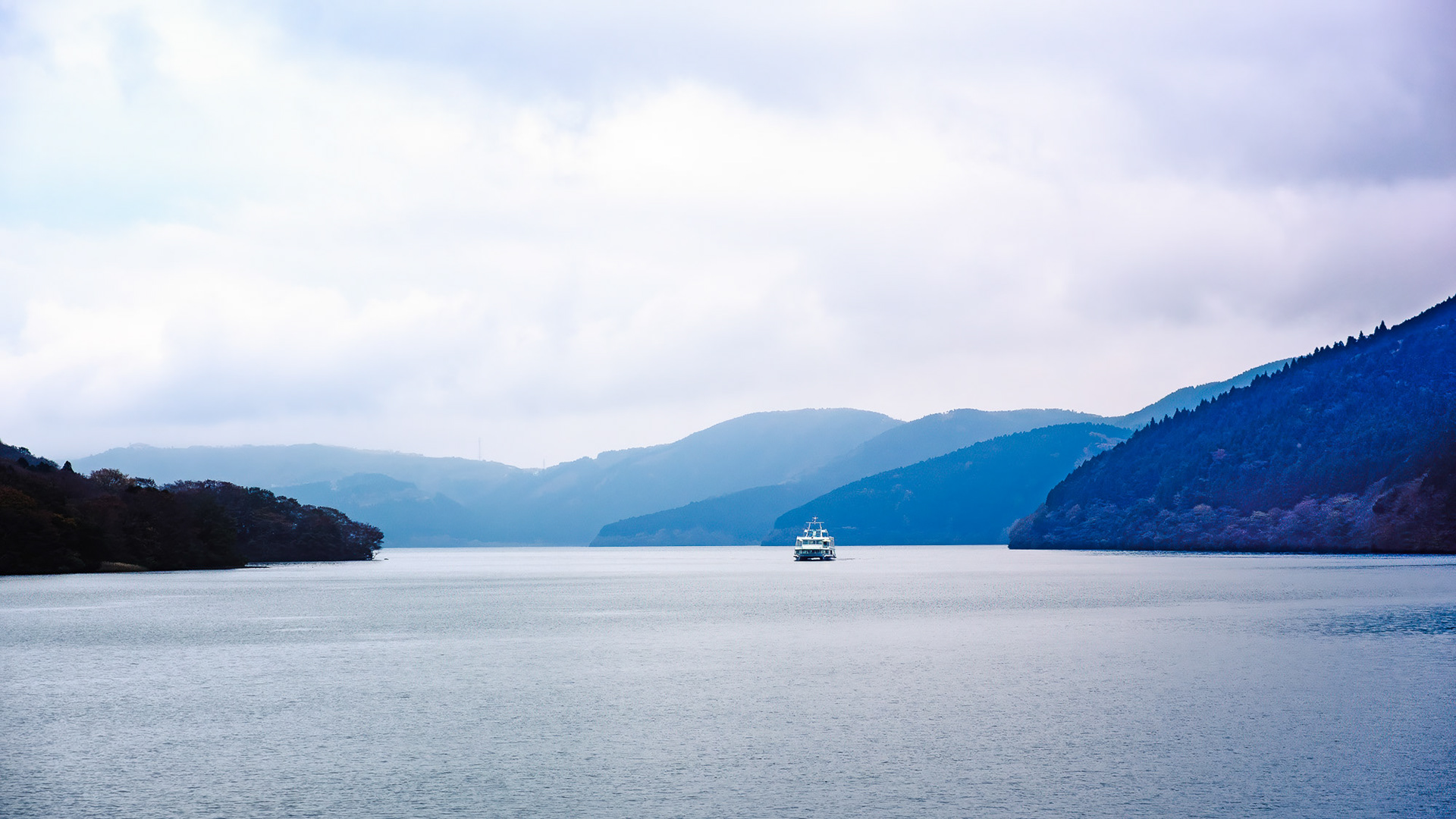 Layered mountains view from pirate ship on Lake Ashi Hakone