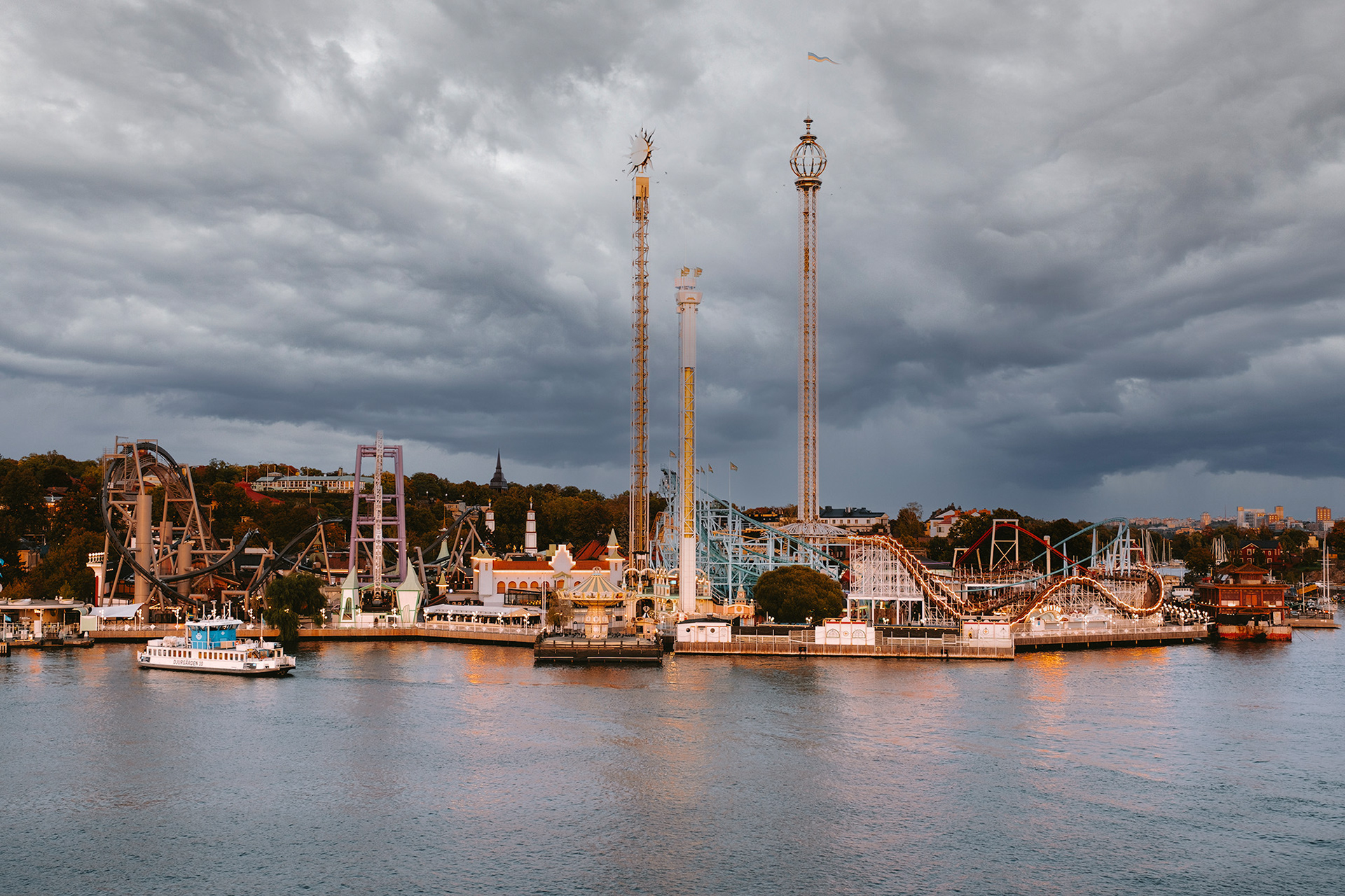 Gröna Lund amusement park in Stockholm photographed from Kastellholmen with dark storm clouds above