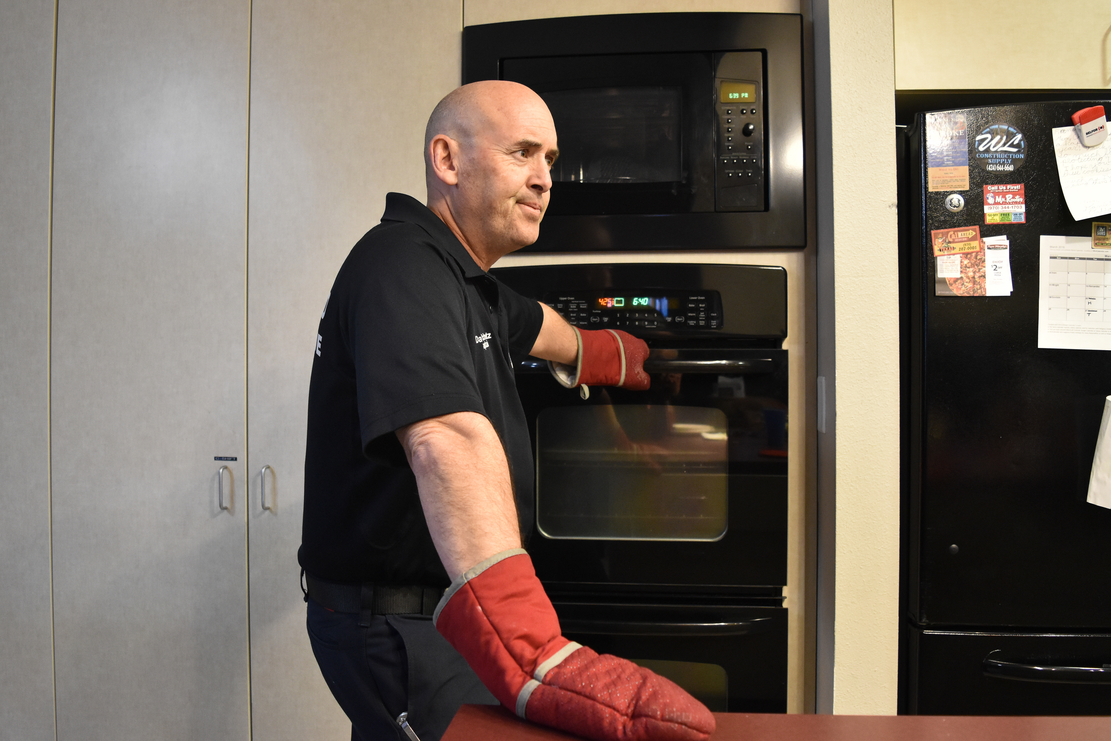 Capt. Dave Schuetz waits for the dinner timer to go off, Station 6, March 25, 2018.