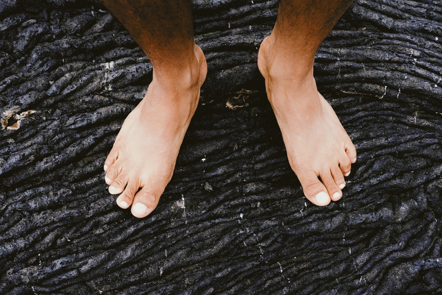 Lava and Feet, Galapagos photo by Joshua Vela Fonseca