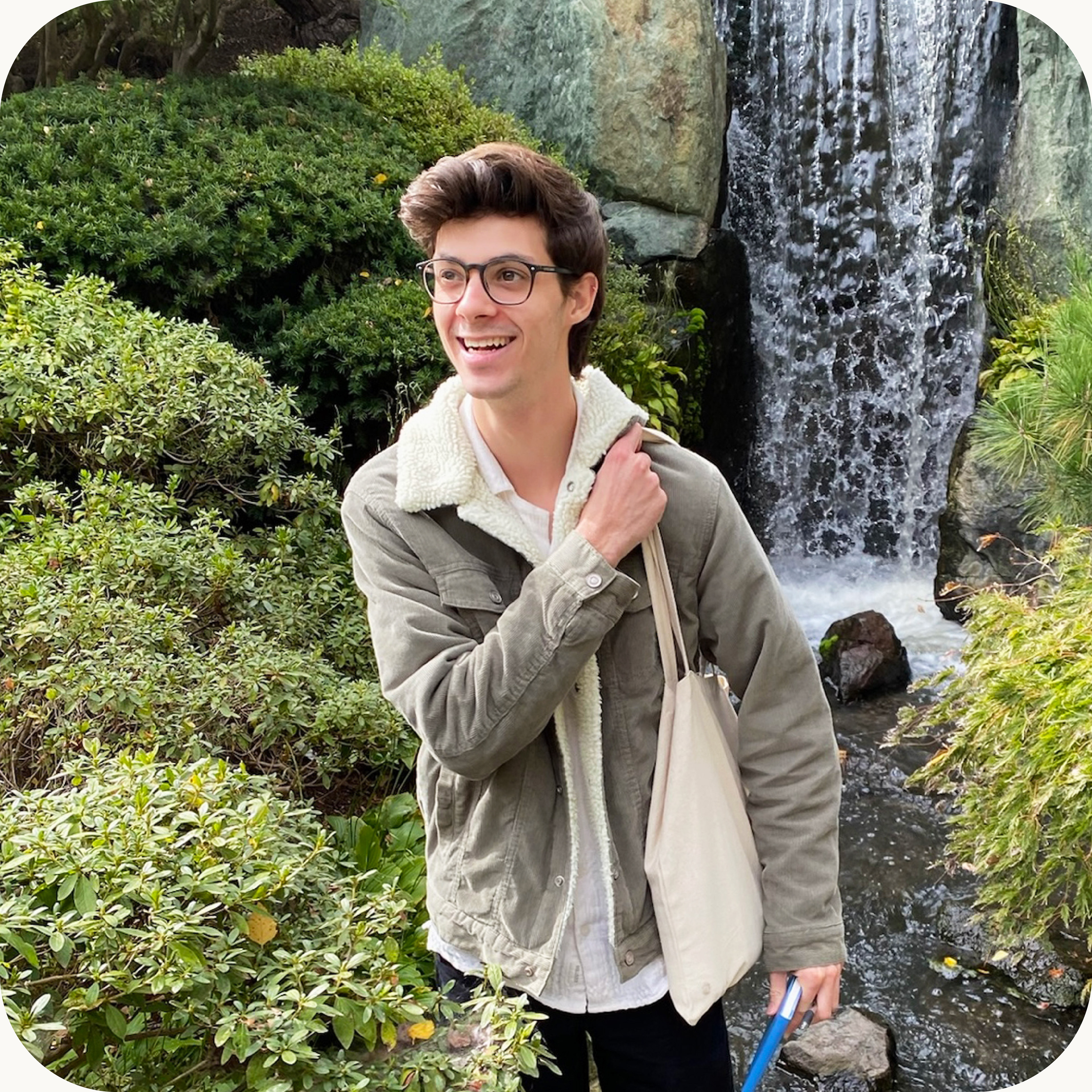 Picture of Dustin Paden. Brown hair, caucasian, round brown glasses, green corduroy sherpa jacket.