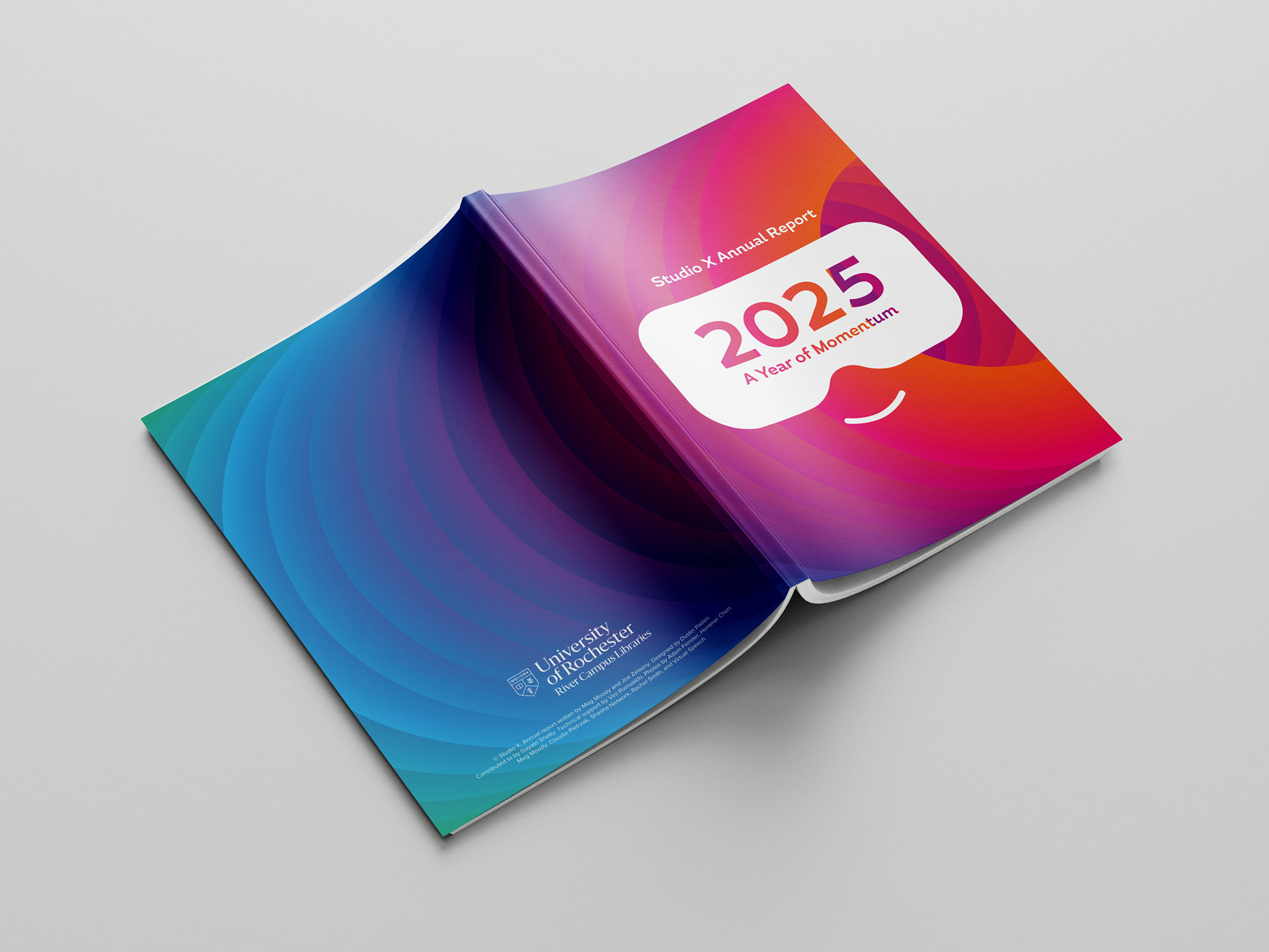 Photo of printed annual report book upside down, showcasing front and back cover design.