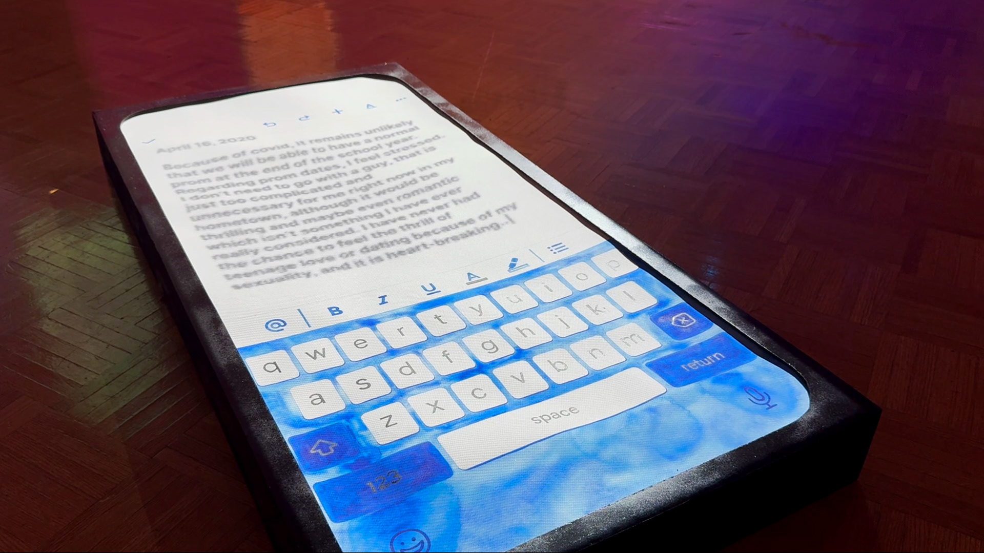 reflections installation image: google doc with blue keyboard laying on floor, projected journal entires type out onto the screen about past queer experiences and emotions.