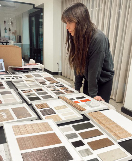 BTS of Mary Phillips and team reviewing curation