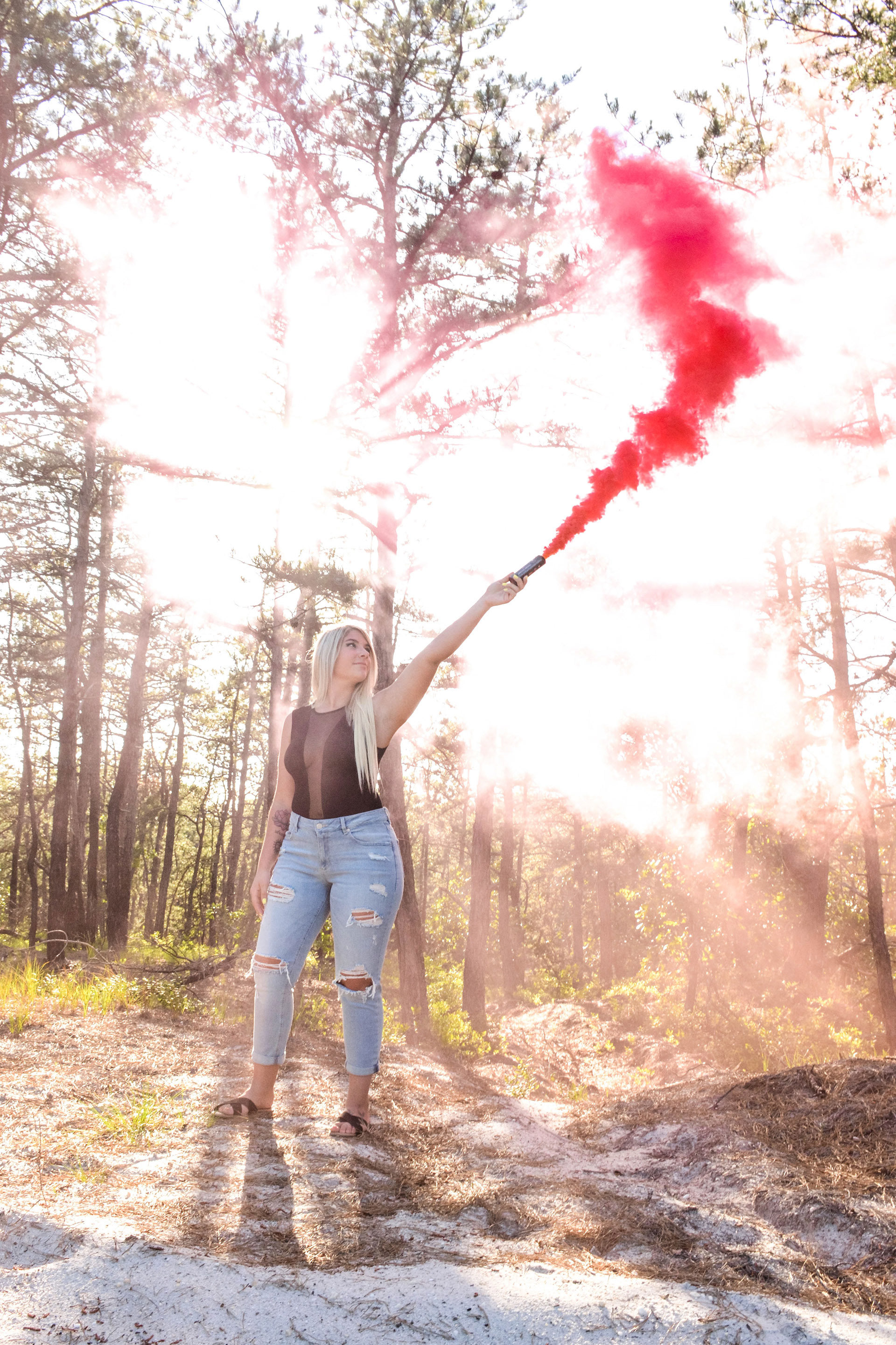 Model holding a red flare