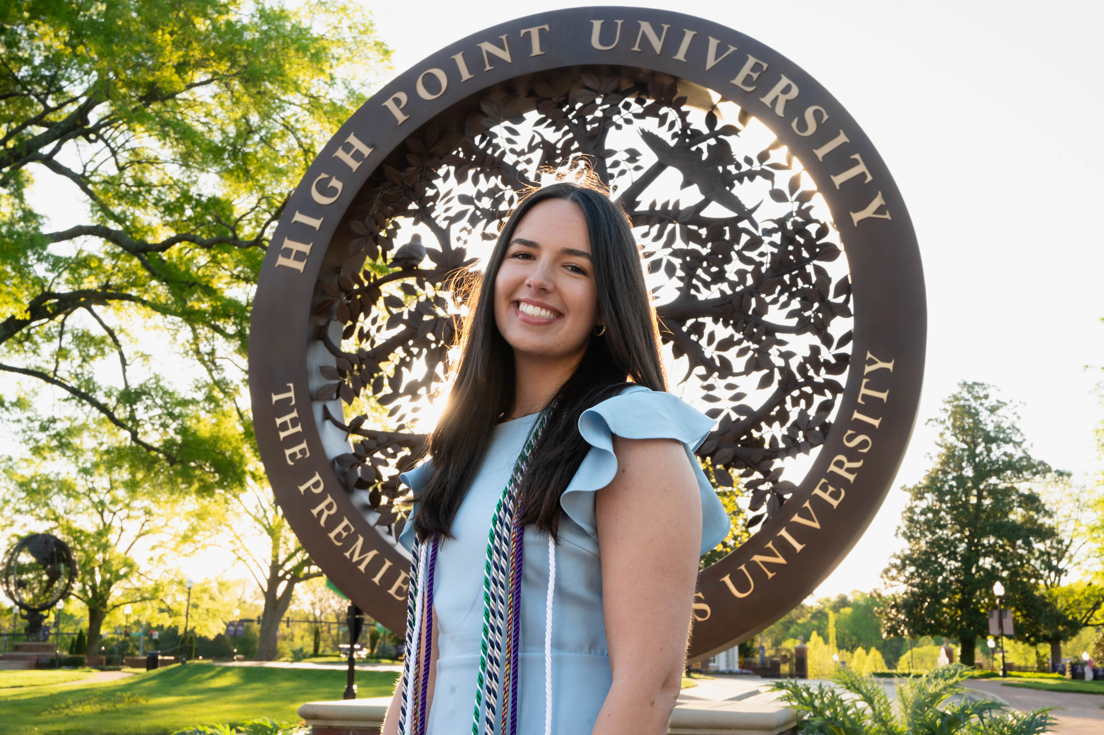 Girl standing in front of a significant spot on campus