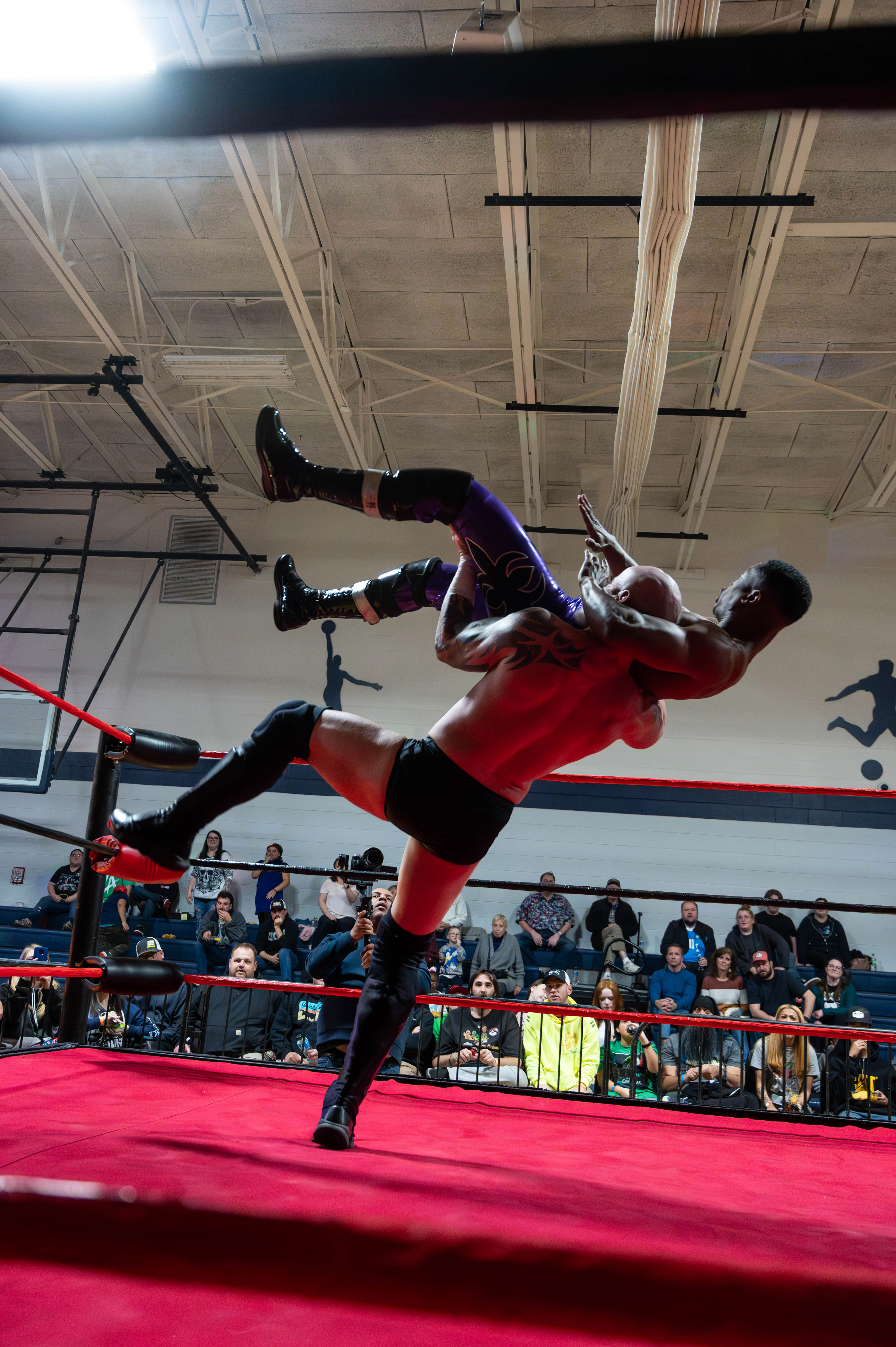Wrestlers fighting in a ring