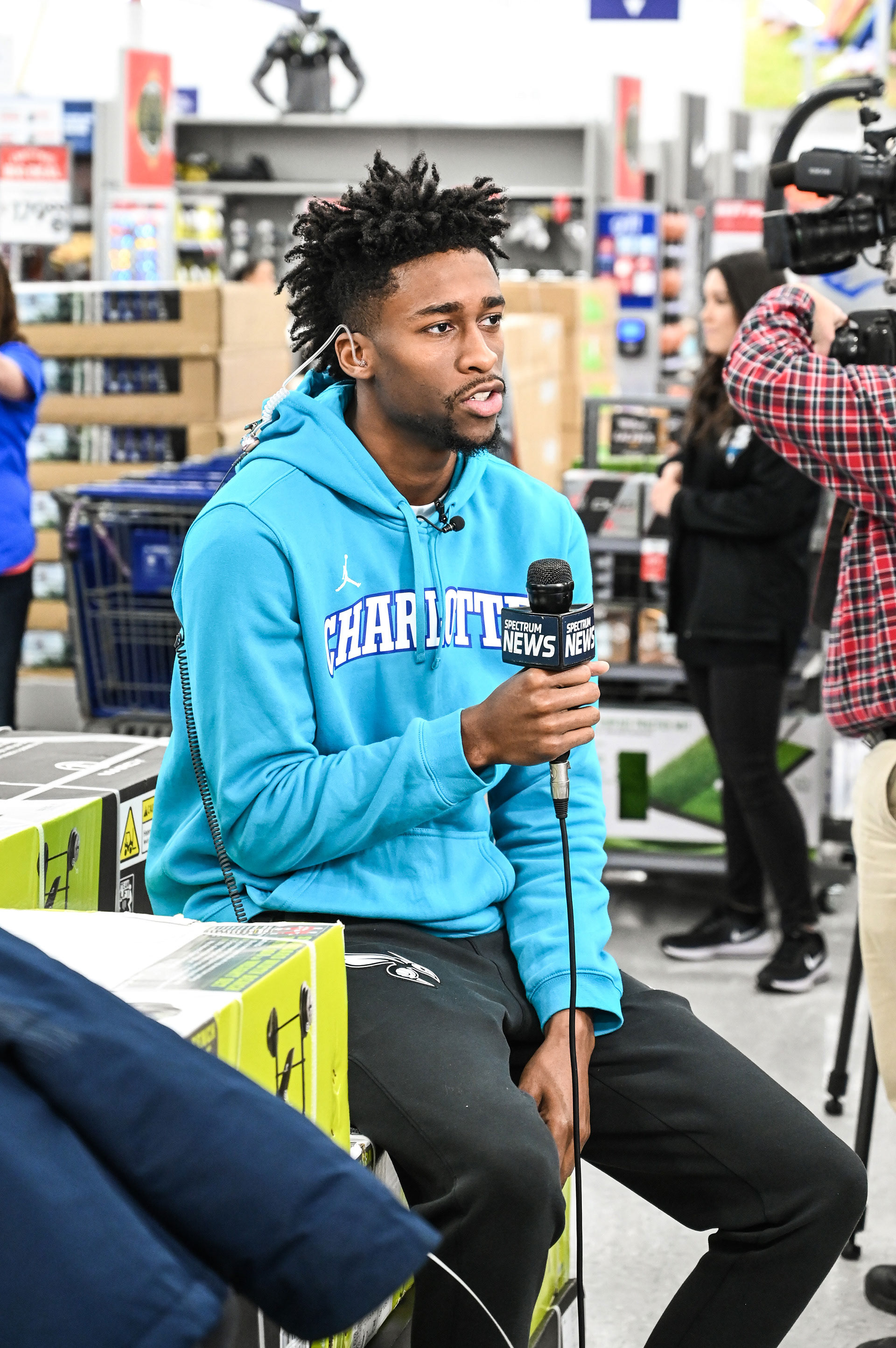 Kobi Simmons being interviewed by reporters