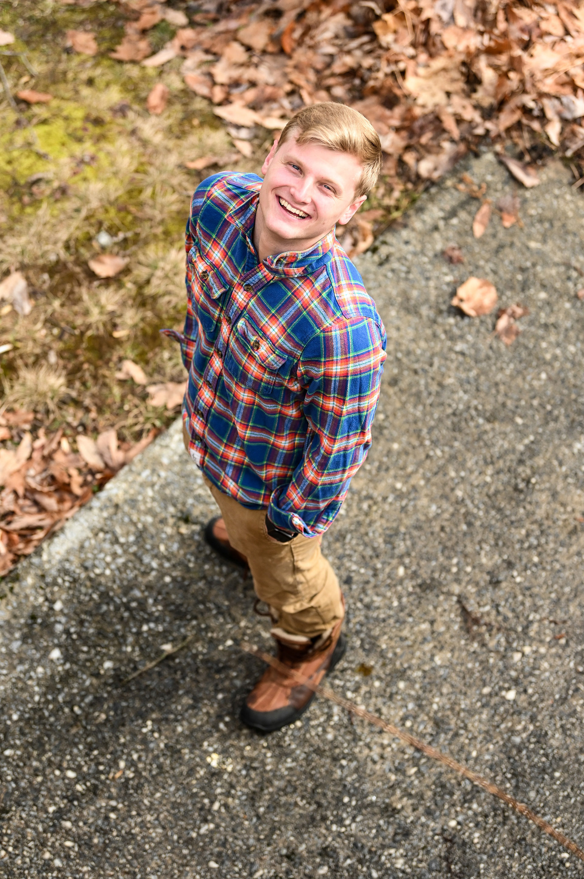 Downward shot of a man in a flannel smiling