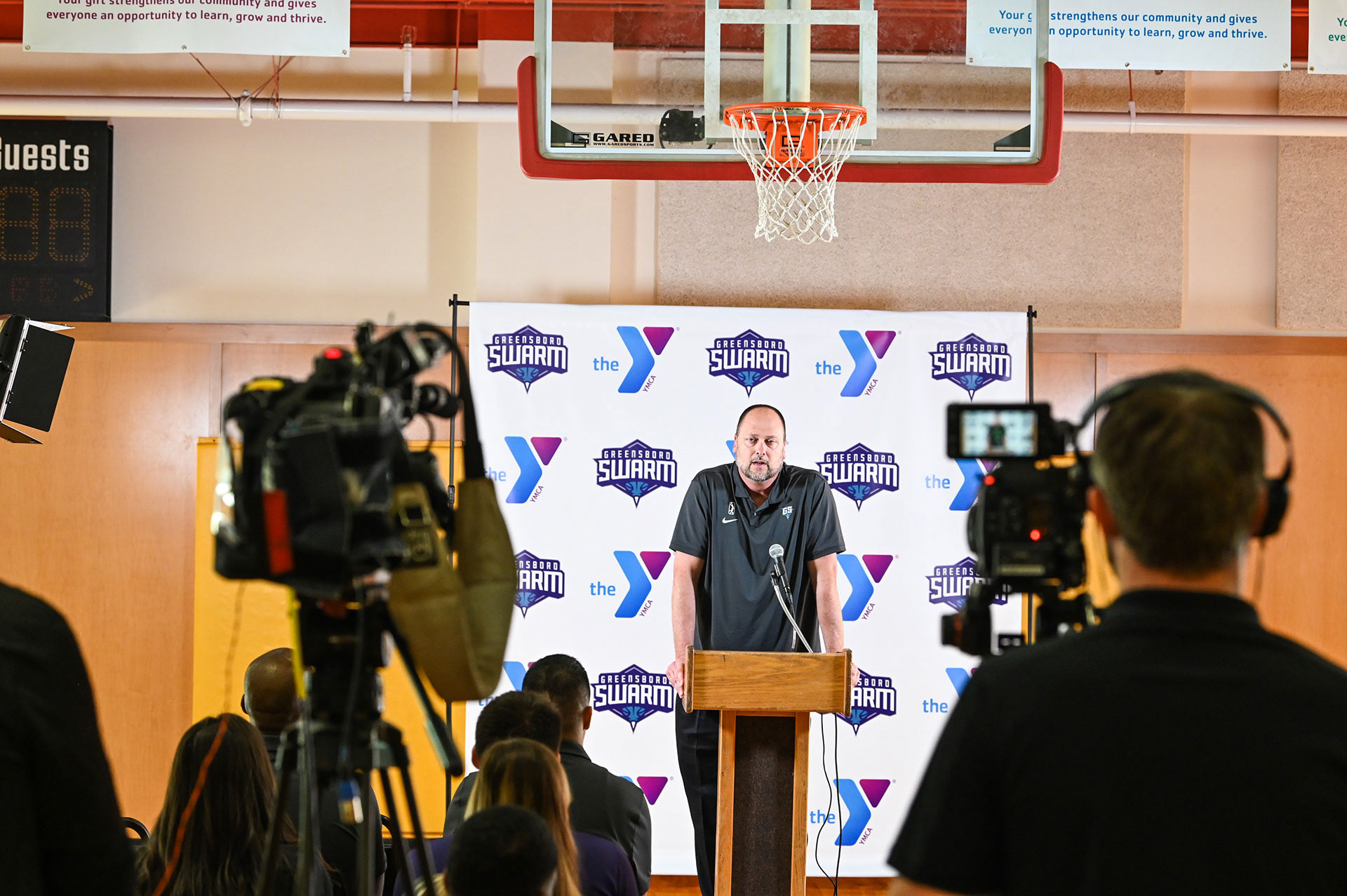 Head coach Joe Wolfe doing an interview on Media Day